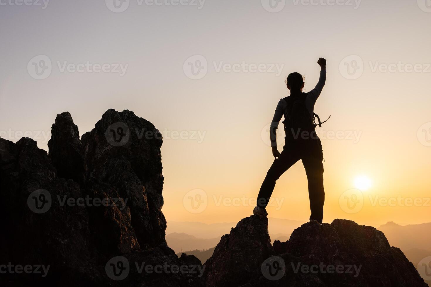 Silhouette of A person standing on top of the mountain Travel and adventure. Mountain hiking. photo