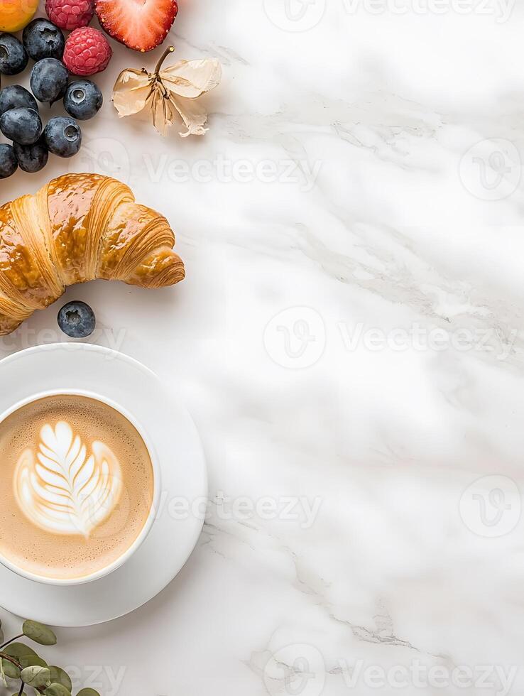 Breakfast with croissant, berries and coffee on marble background photo