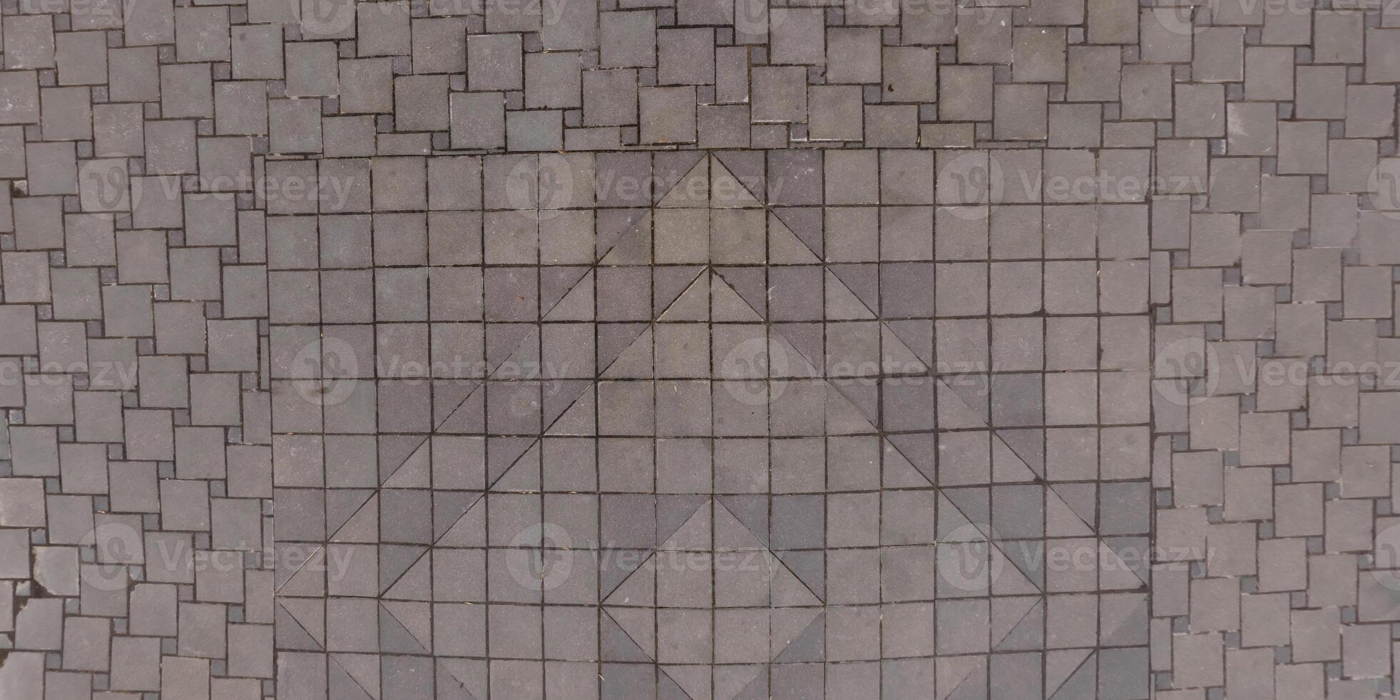 A large square tile pattern on the ground photo