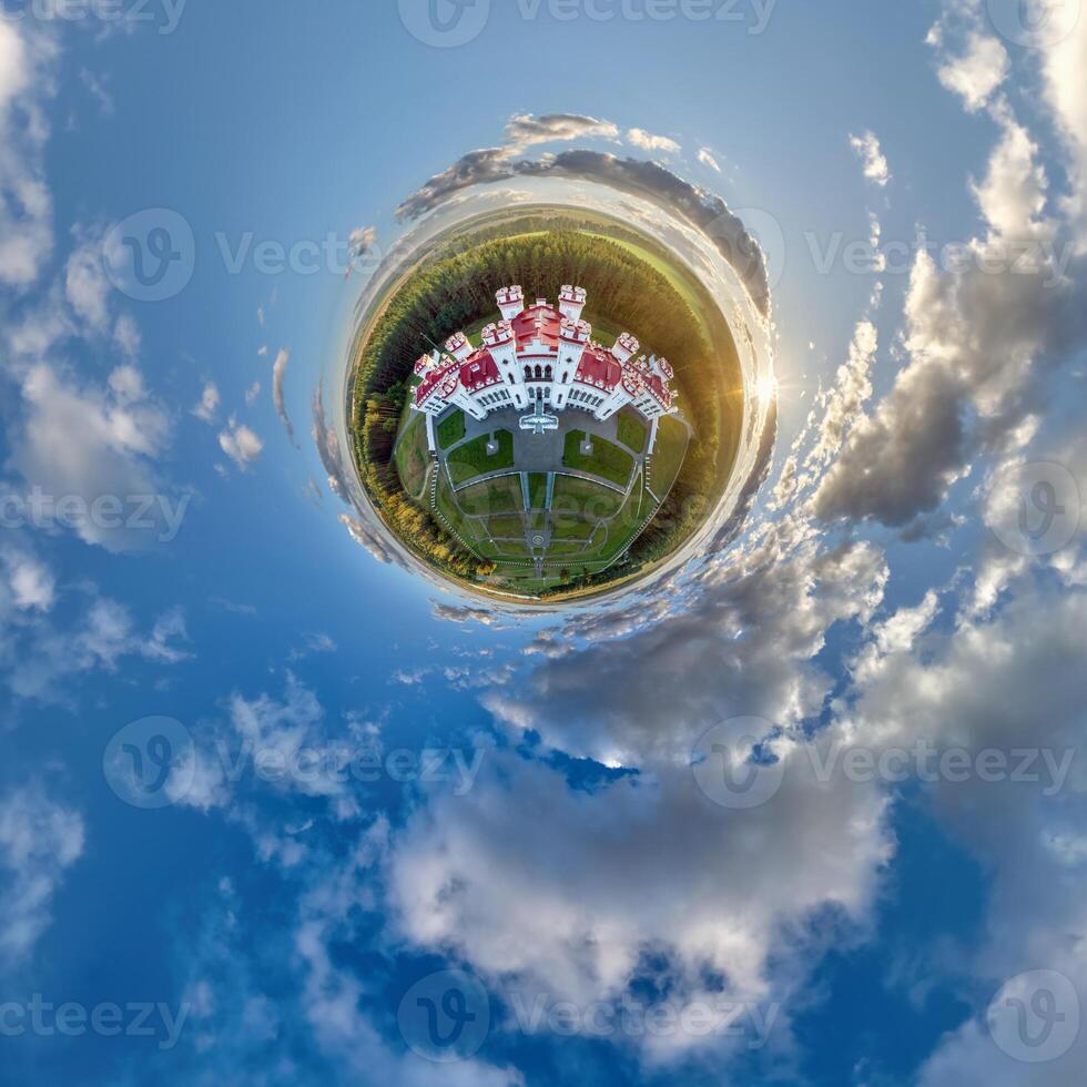 A small planet with a house in the sky photo
