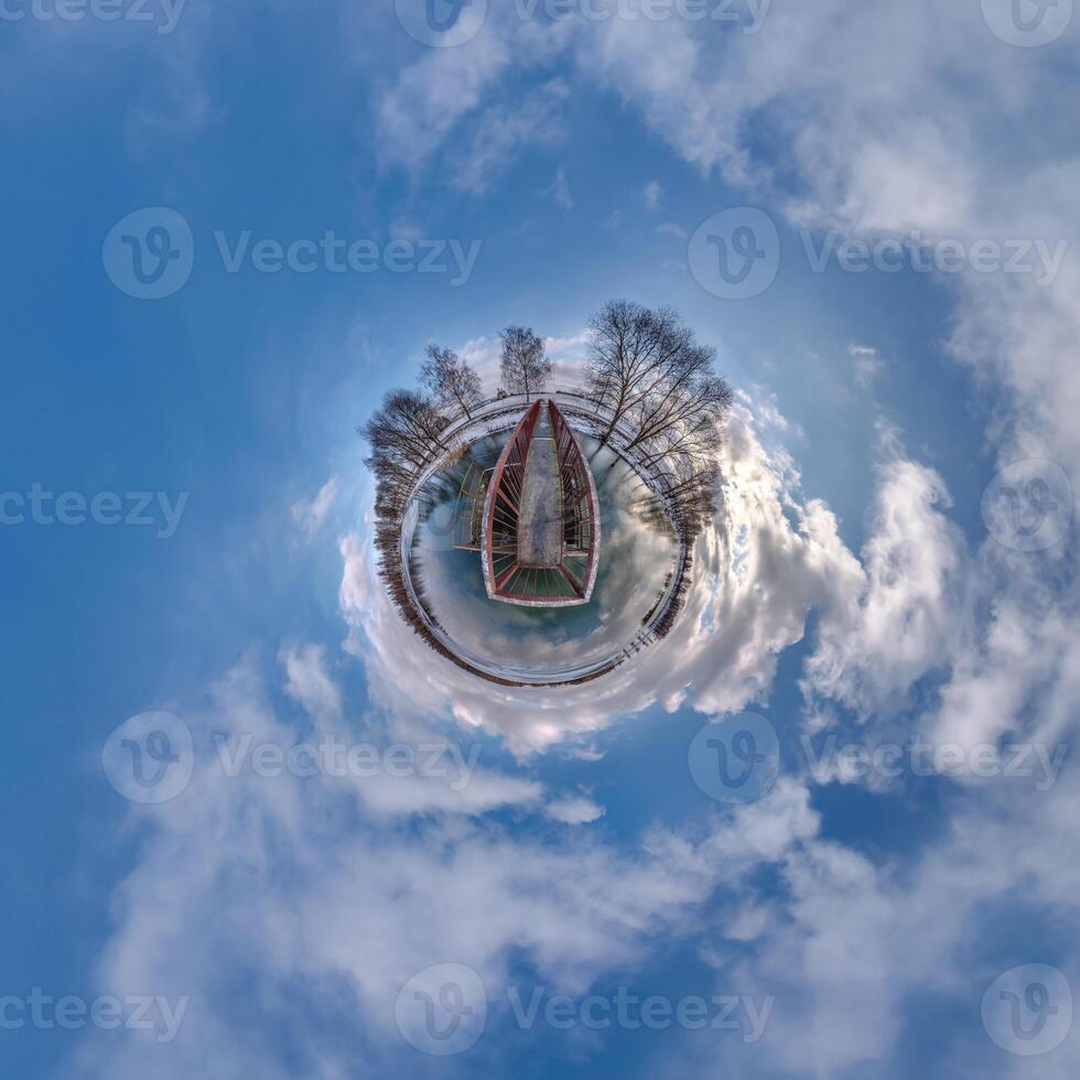 A small planet with a boat in the middle photo