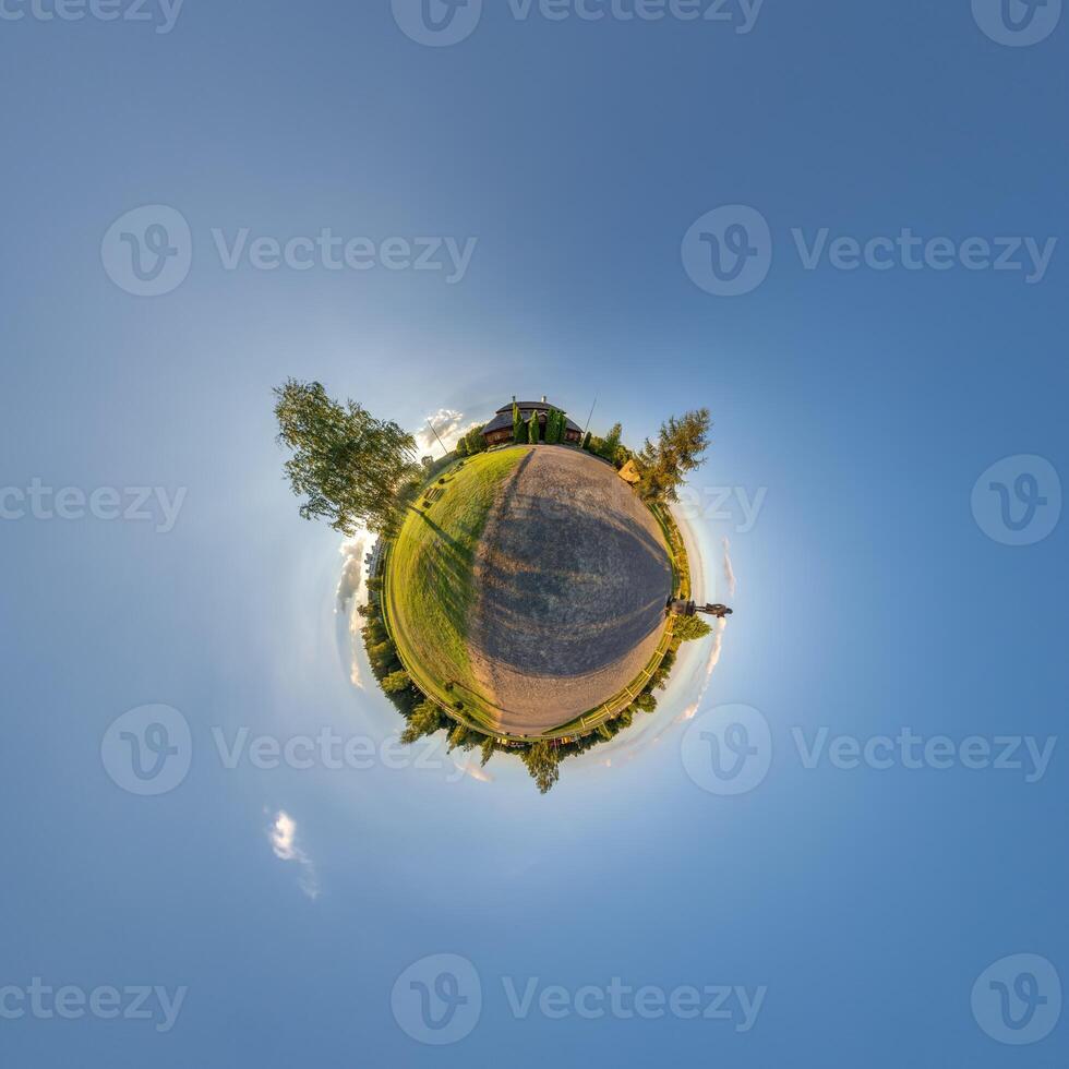A small planet with a road and trees photo