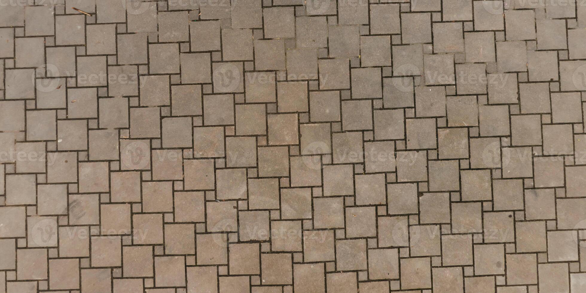 A close up of a brick wall with a few squares photo