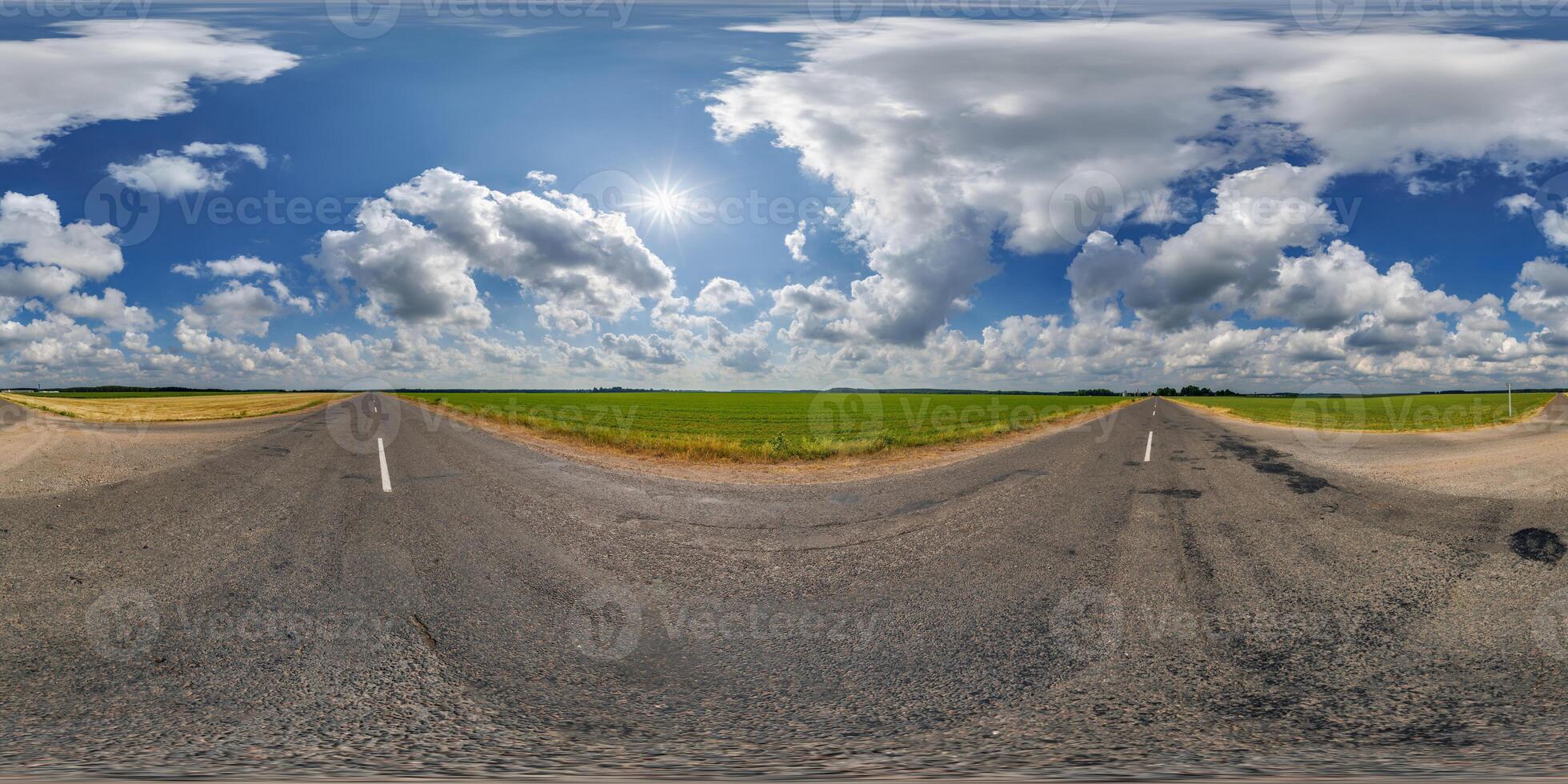 360 panorama of a road with clouds and sun photo