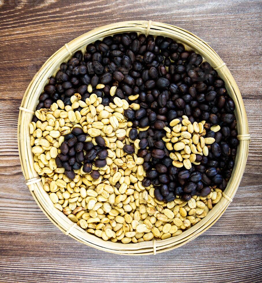 coffee beans in the shape of a yin and yang symbol with wood background for marketing photo