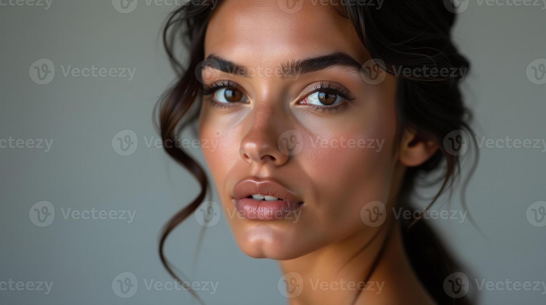 A woman with wavy hair and intricate makeup. photo