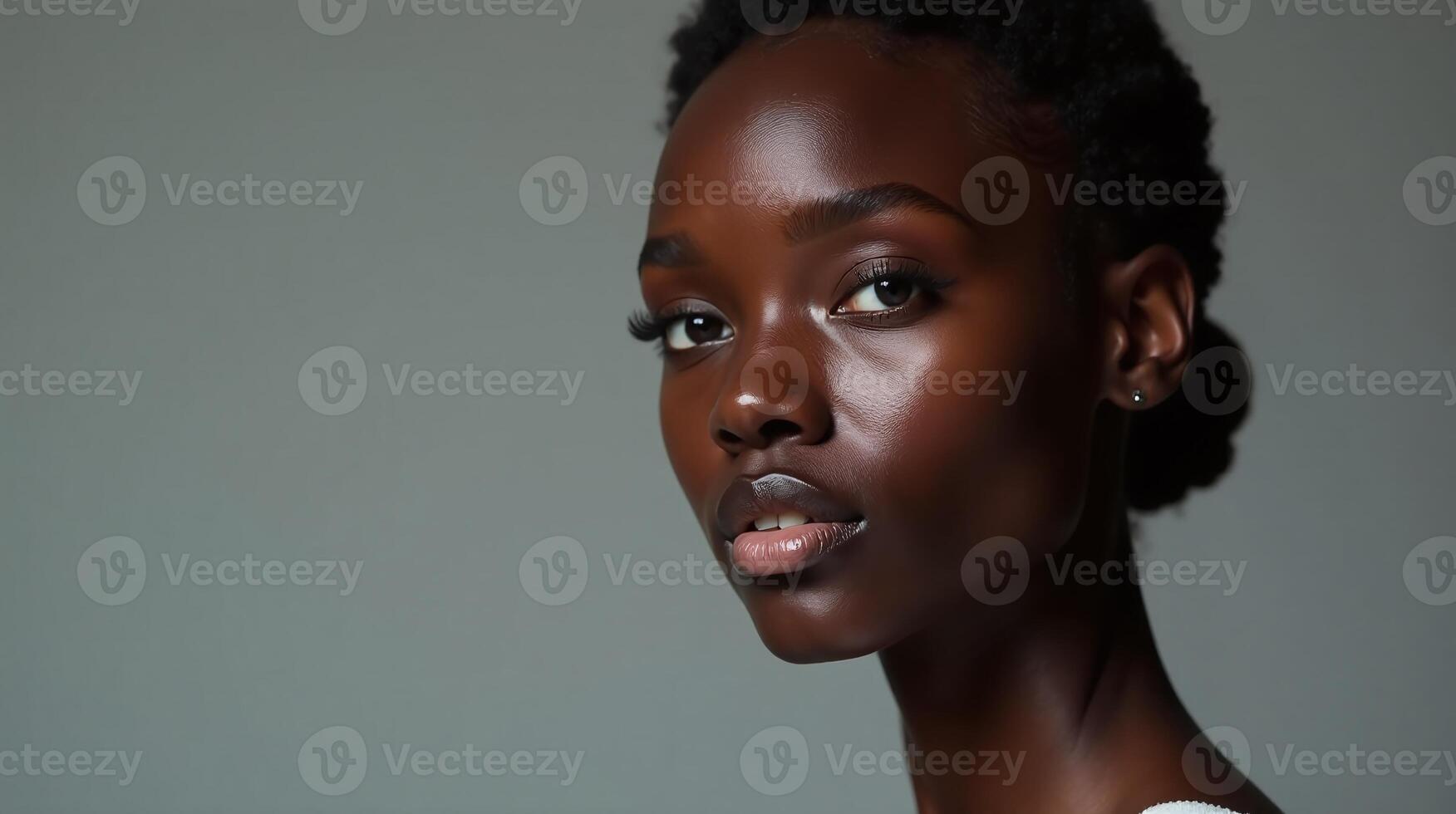A woman with a striking visage, minimal makeup, and a thoughtful expression. photo