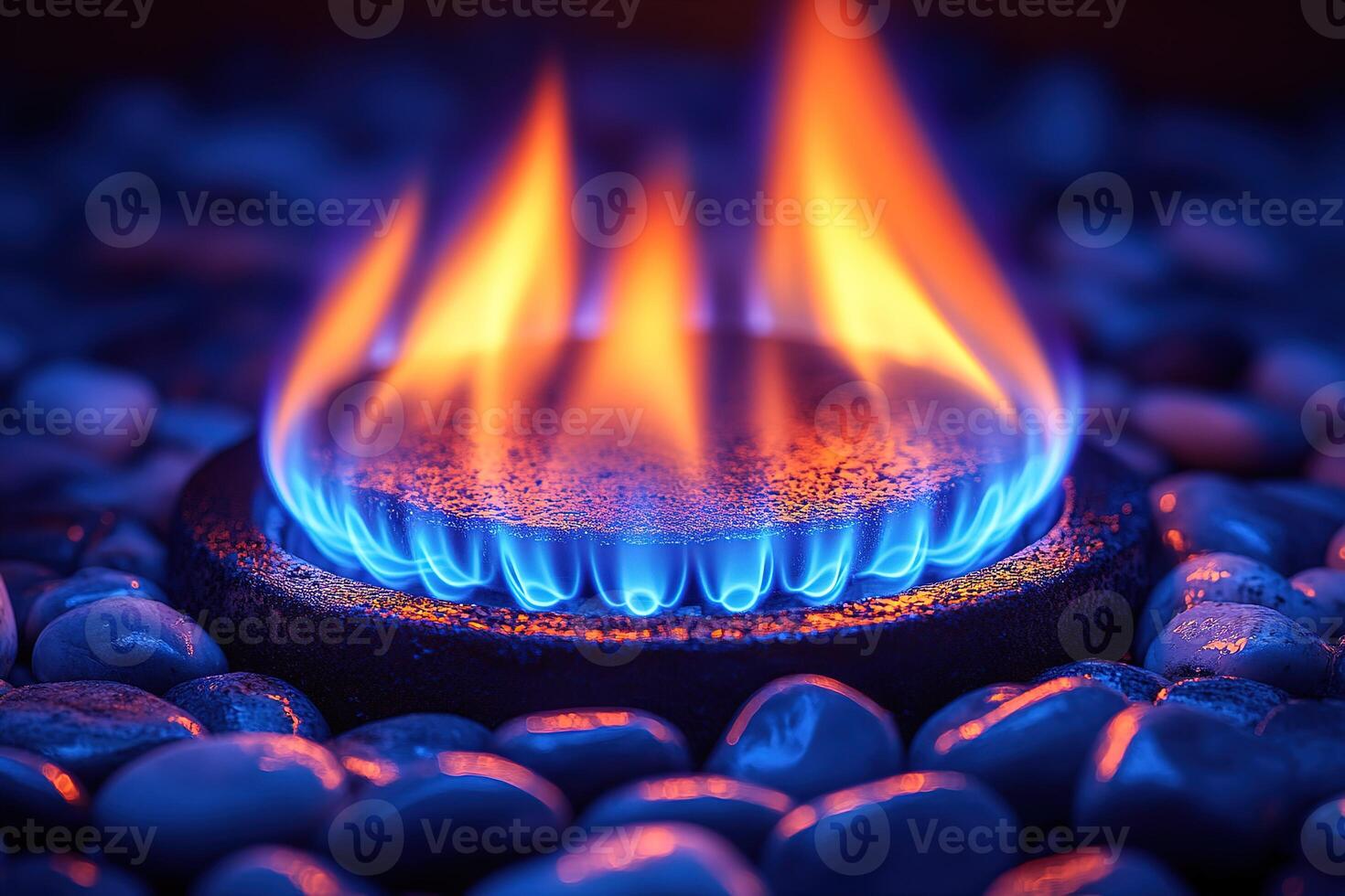 Blue and orange flames dance on a burner. photo