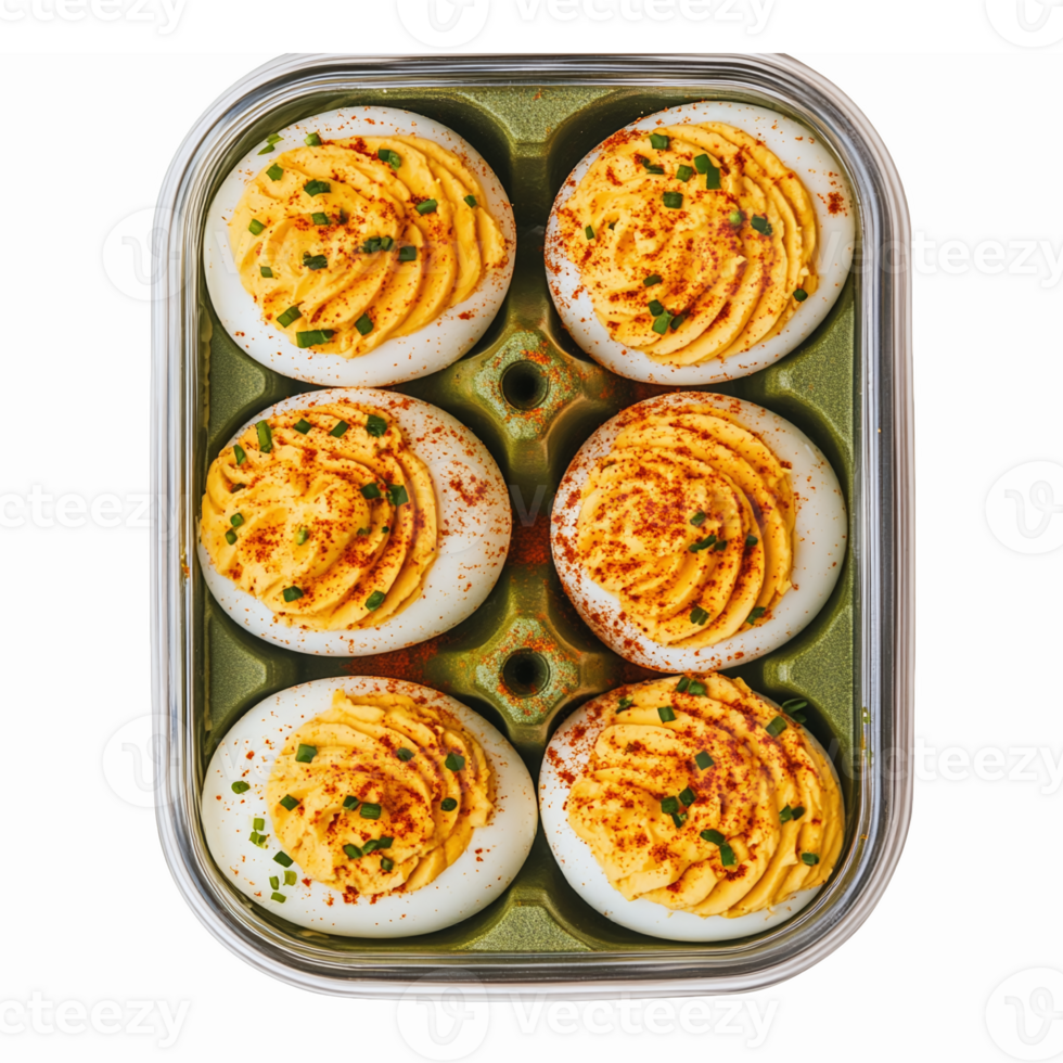 Deliciously Garnished Deviled Eggs in Clear Serving Tray with Paprika and Chives png