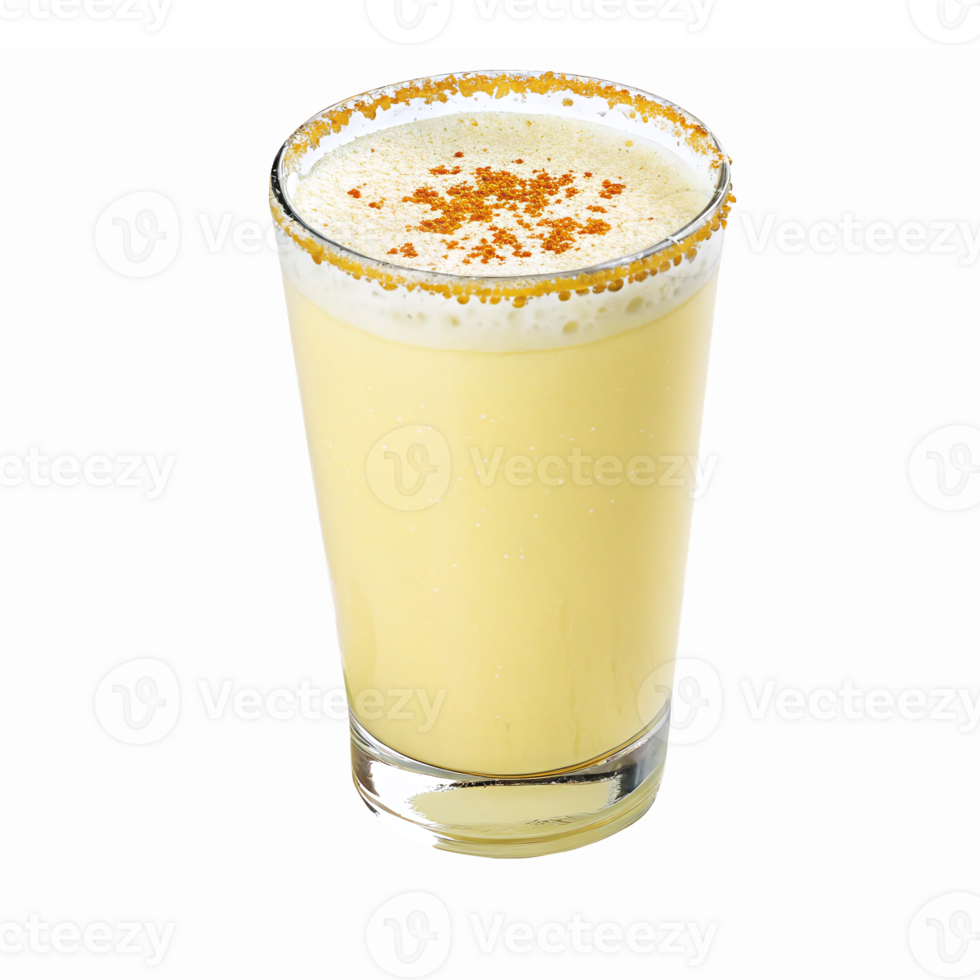 Delicious Creamy Yellow Beverage in Clear Glass Garnished with Spices and Foam png