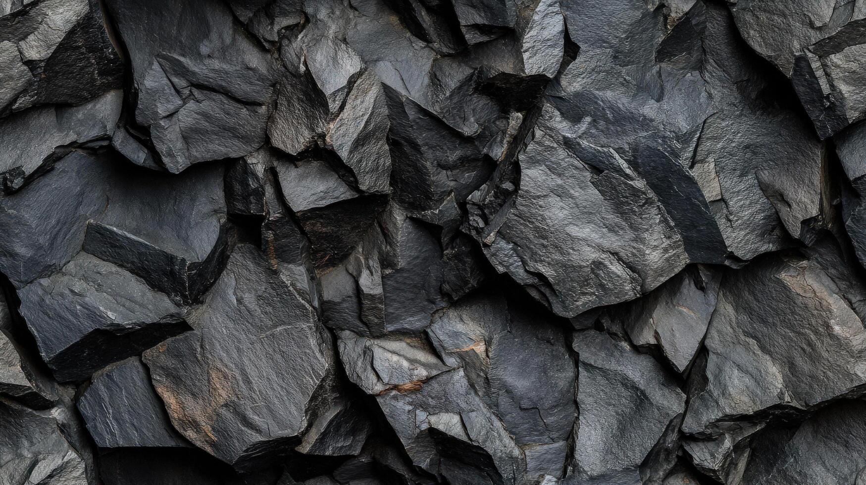 A close up of a large rock wall with many different shapes photo