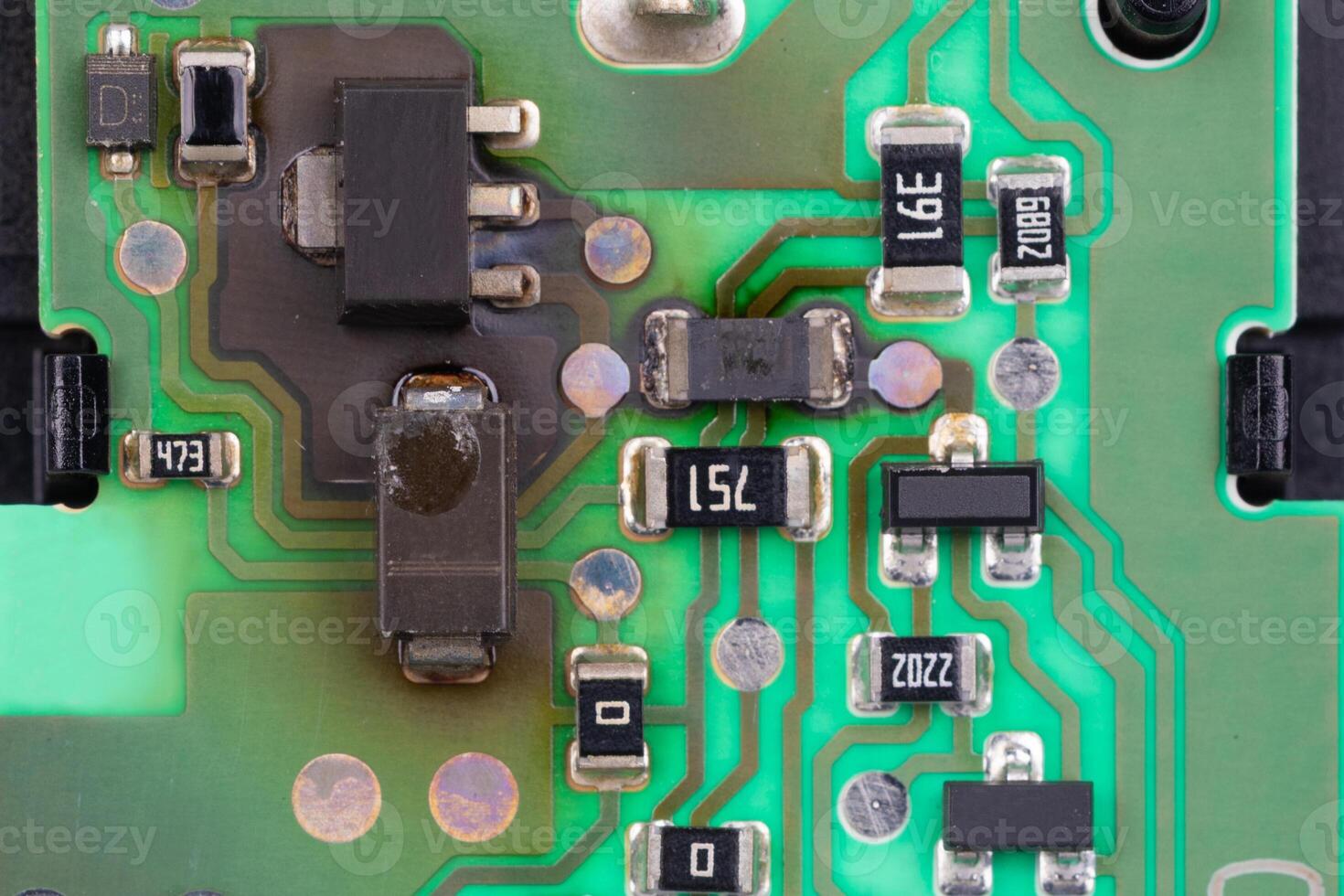 Damaged Electronic Circuit Board with Burnt Components photo
