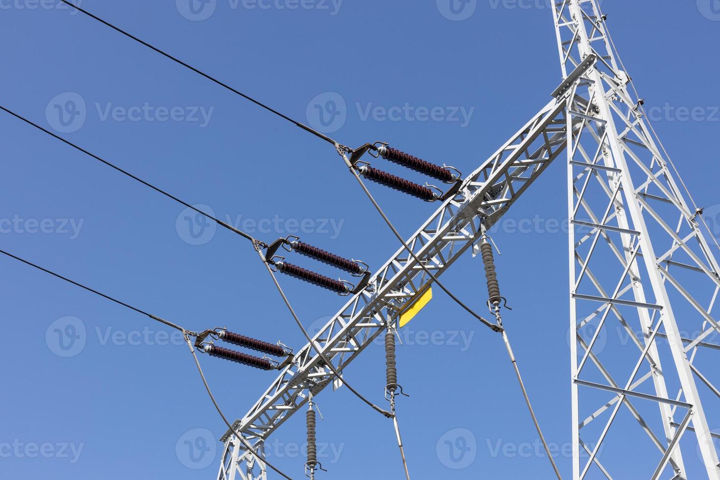 High Voltage Power Lines and Metal Tower Structure photo