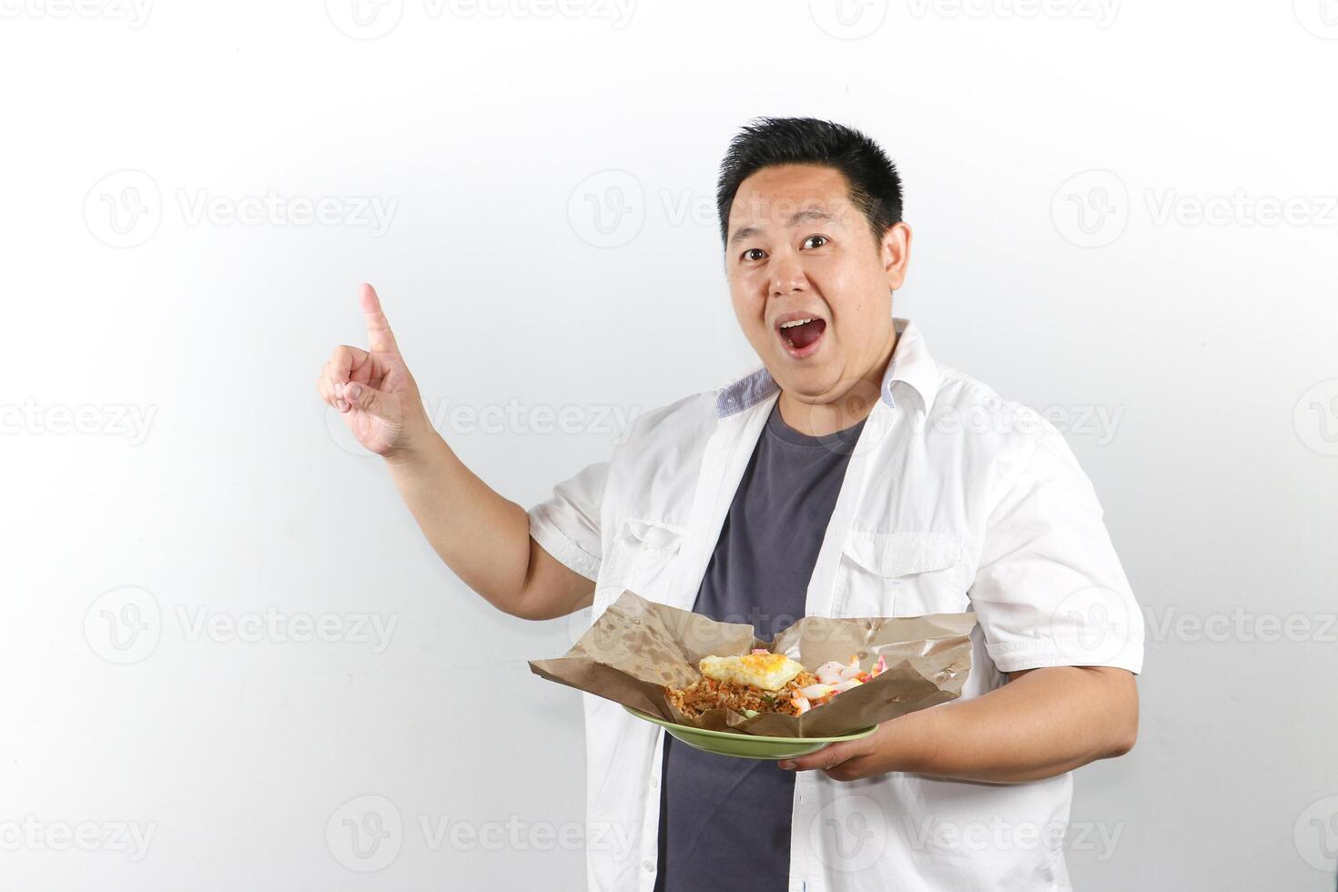 Smiling Happy Man serve Indonesian Fried Rice photo
