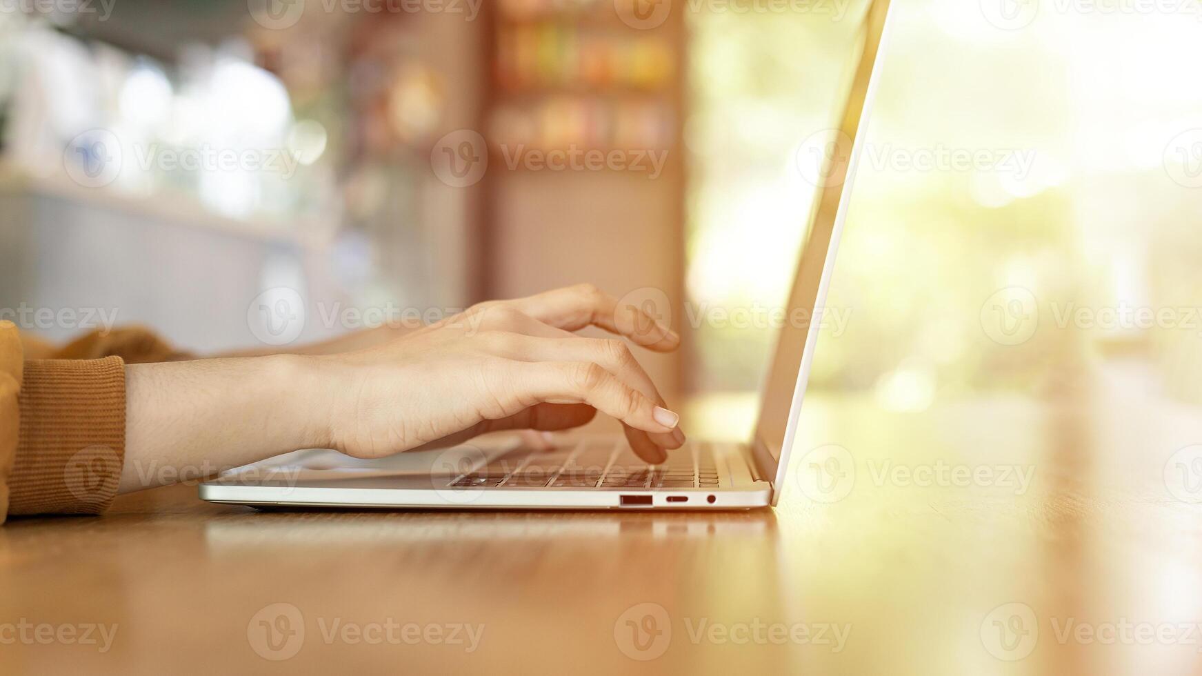 Woman hand working laptop photo