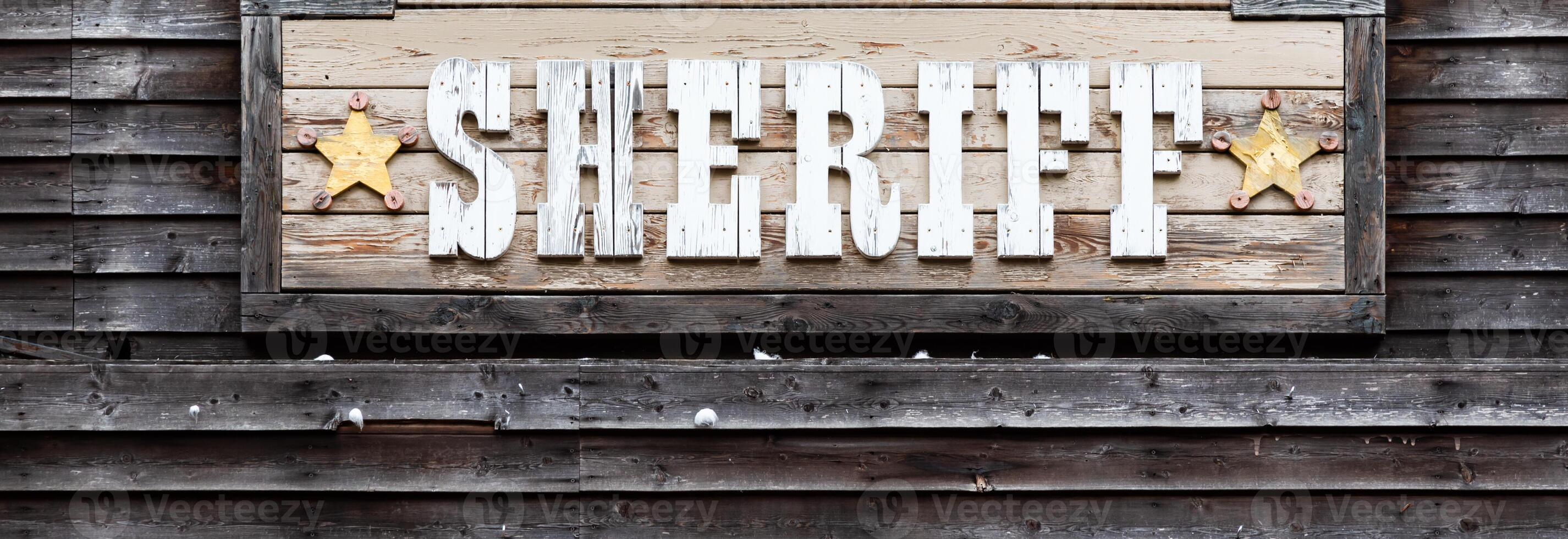 Sheriff sign on vintage background, wild west design. Concepts of justice, protection and security photo