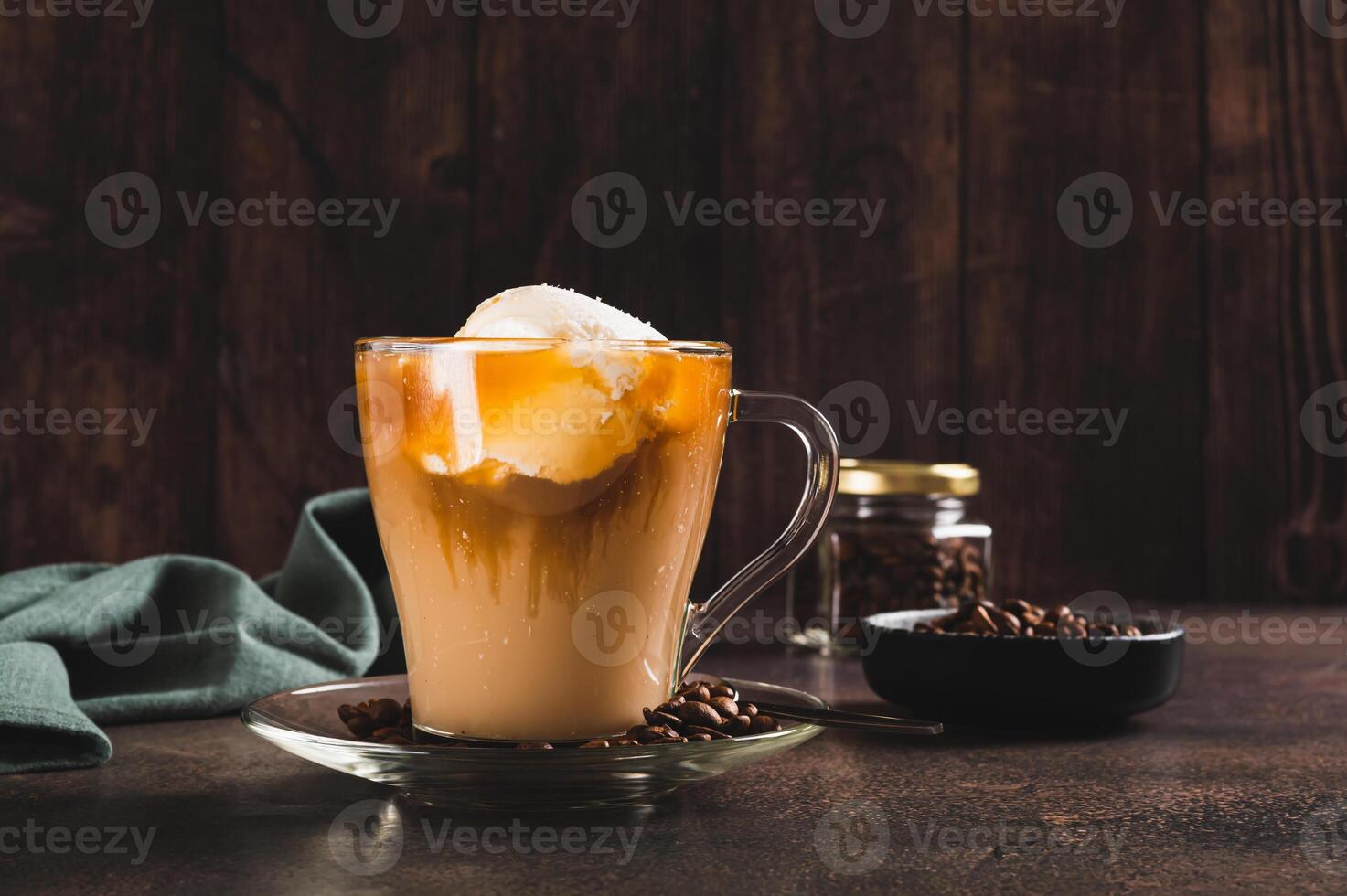 Delicious sweet affogato coffee with creamy ice cream in a cup on the table photo
