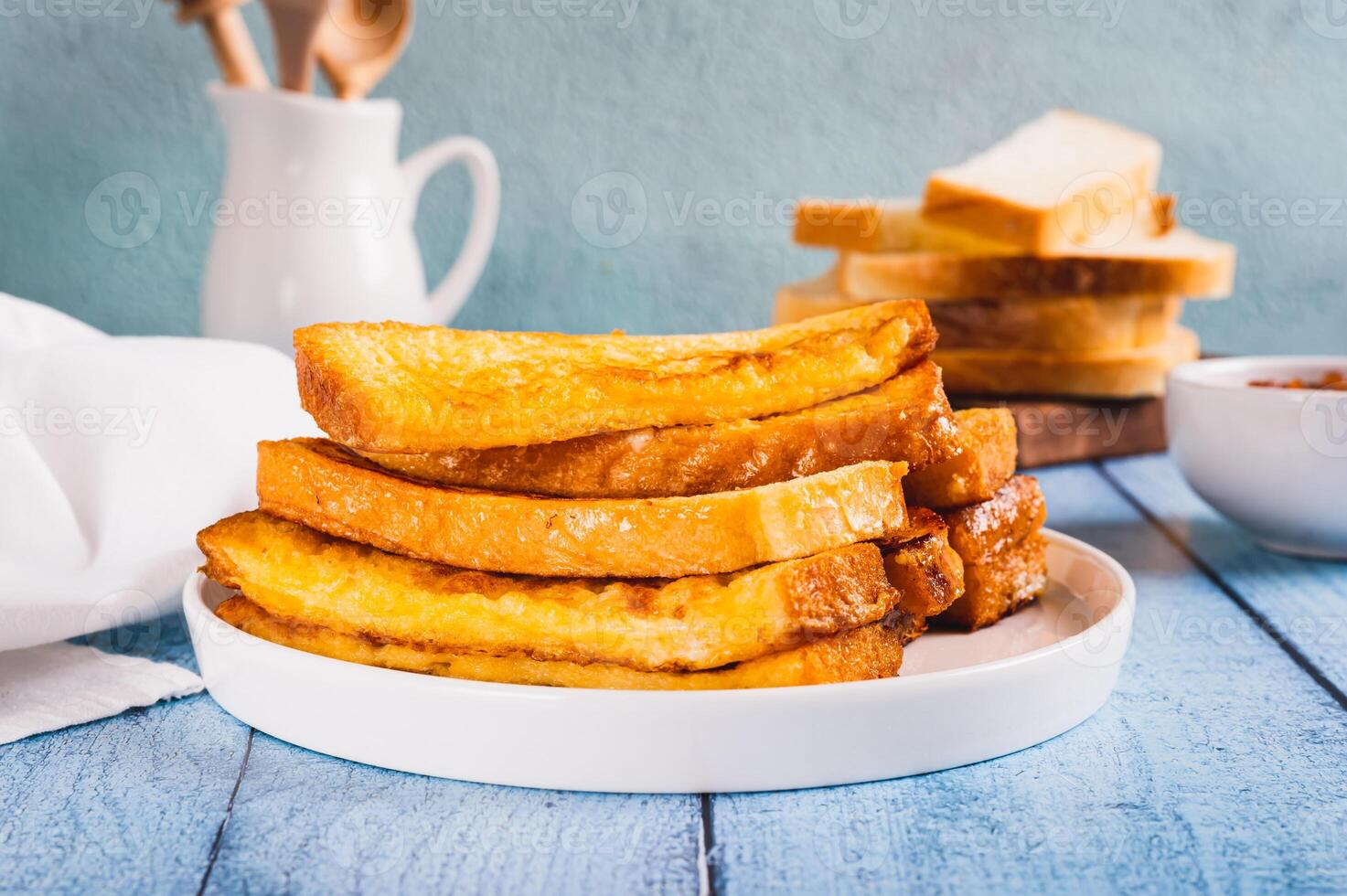 French crispy sweet toast on plate on table photo