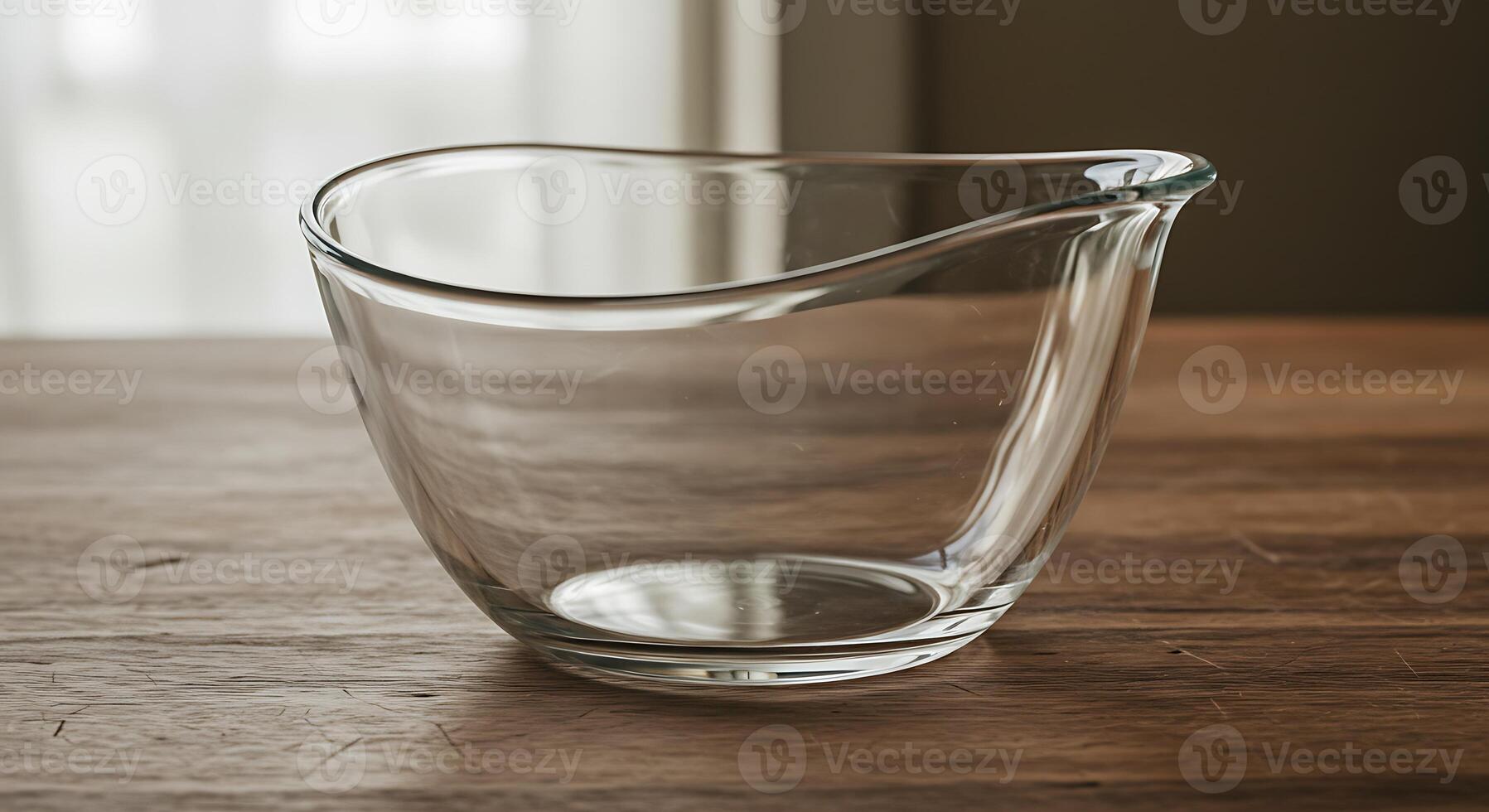 Elegant Empty Glass Mixing Bowl on Wooden Table photo
