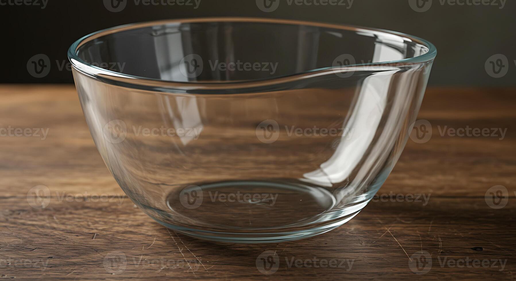 Empty Glass Mixing Bowl on Rustic Wooden Table photo