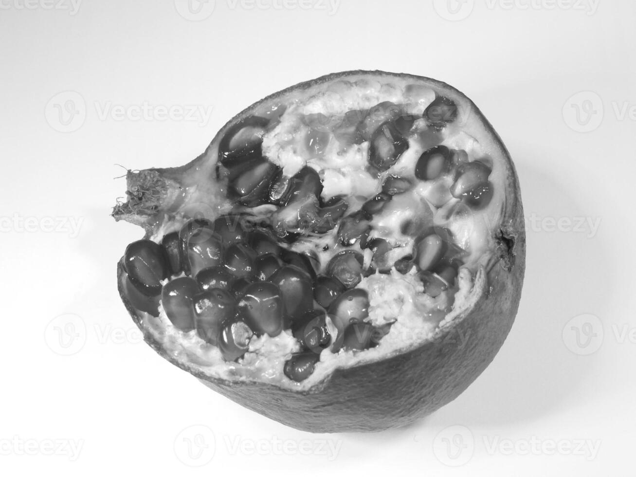 Close Up of Pomegranate Halves with Juicy Seeds for different design purposes photo