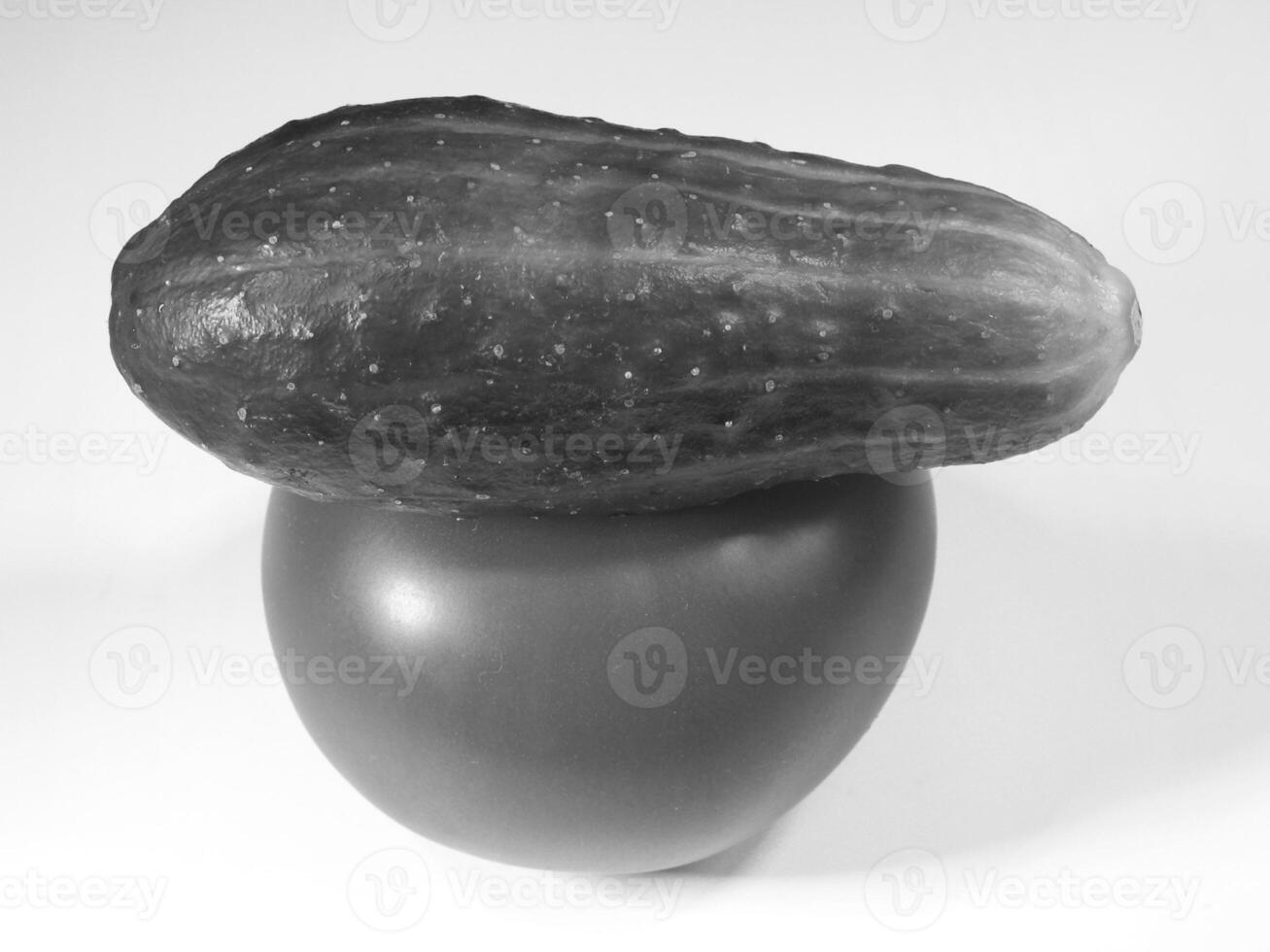 Fresh Cucumber and Tomato Stacked on White Background creative background photo