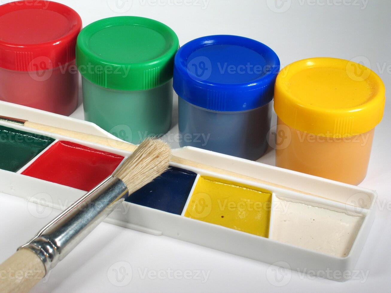 Colored paint cans over white background , creative wallpaper photo