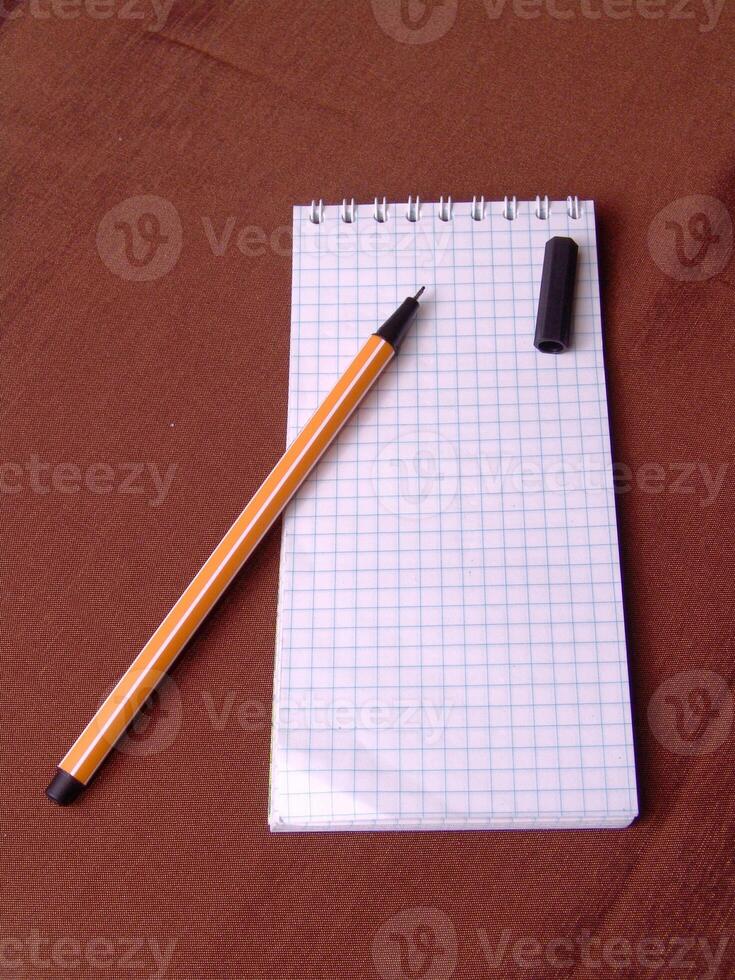 Empty notebook and a pen background creative wallpaper photo