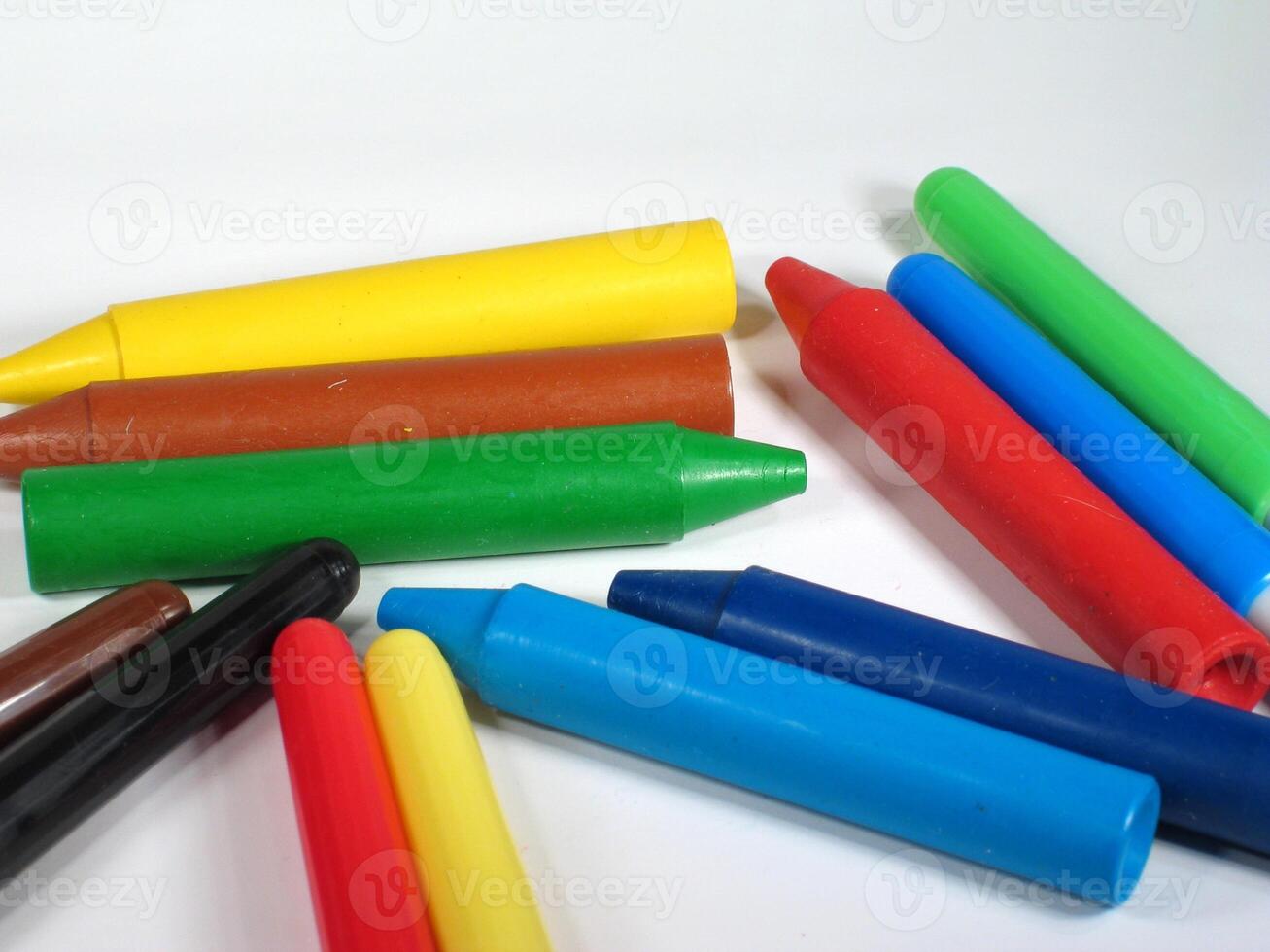 Colorful Wax Crayons on White Background creative background photo