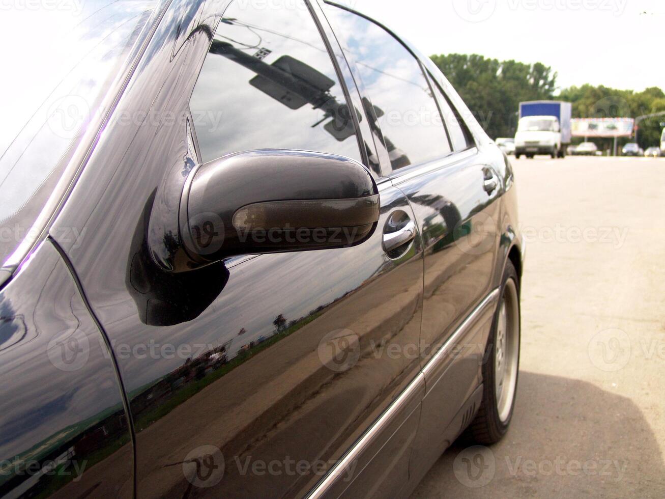 Black Car Side Mirror and Door Reflection photo