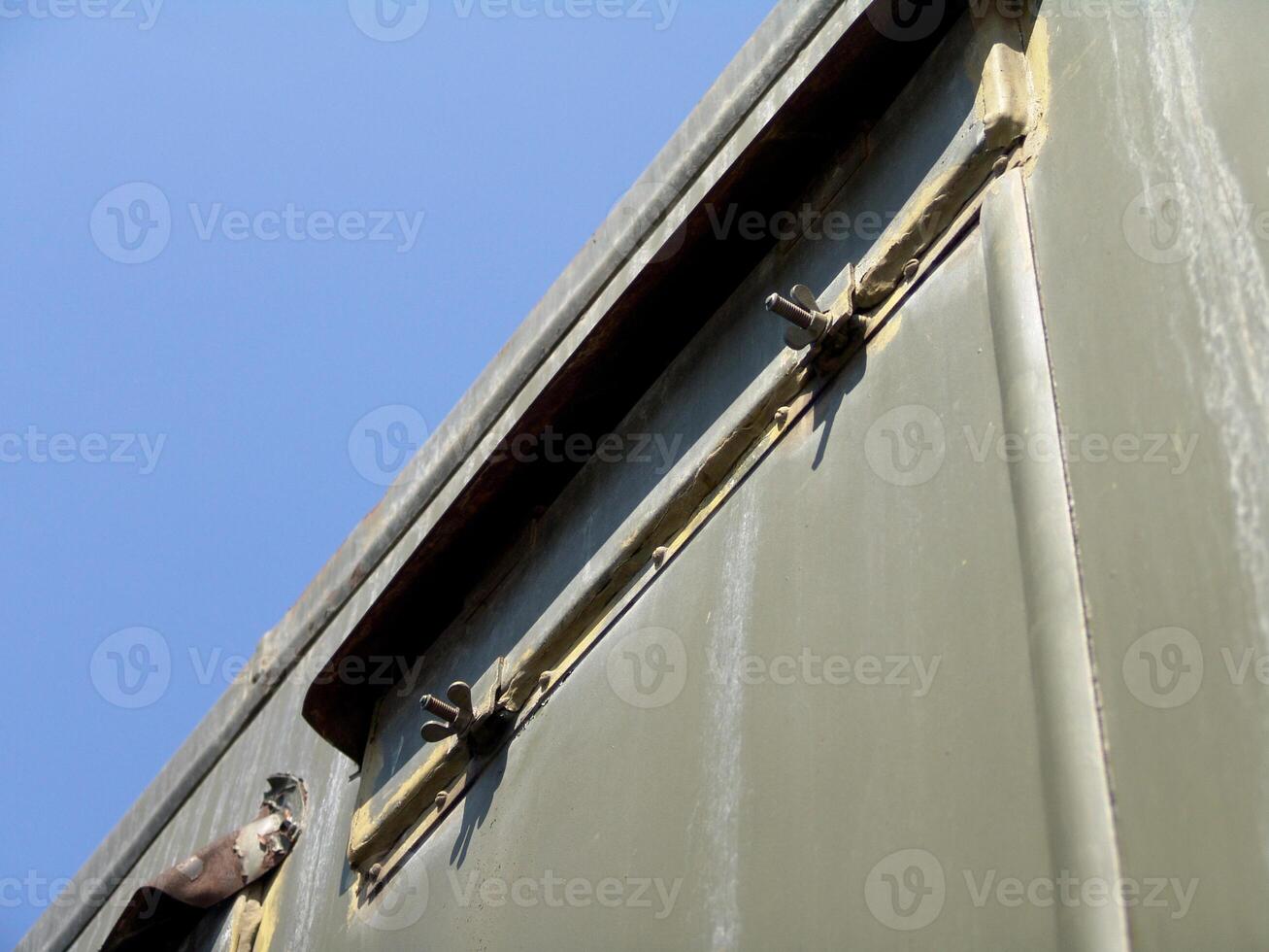 Military Green Metal Panel with Wing Nuts photo