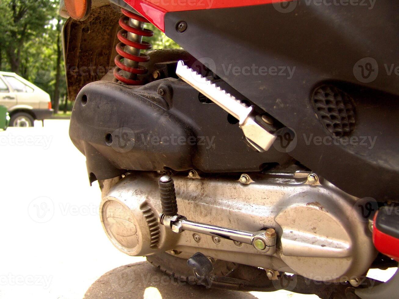 Motorcycle Engine and Foot Peg Close Up photo