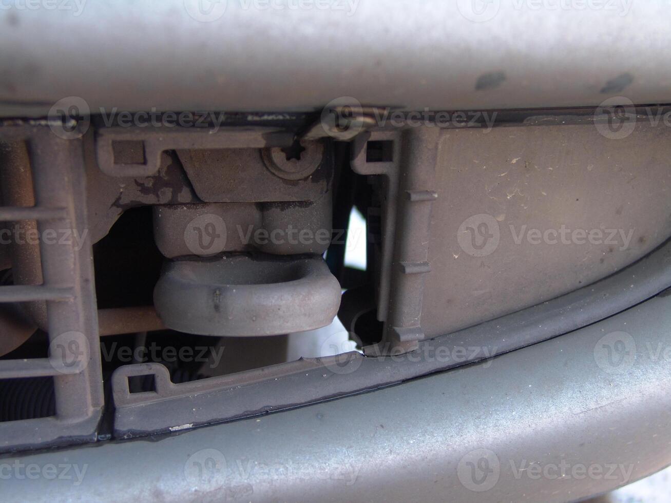 Close up of Car Front Bumper Tow Hook and Grill photo