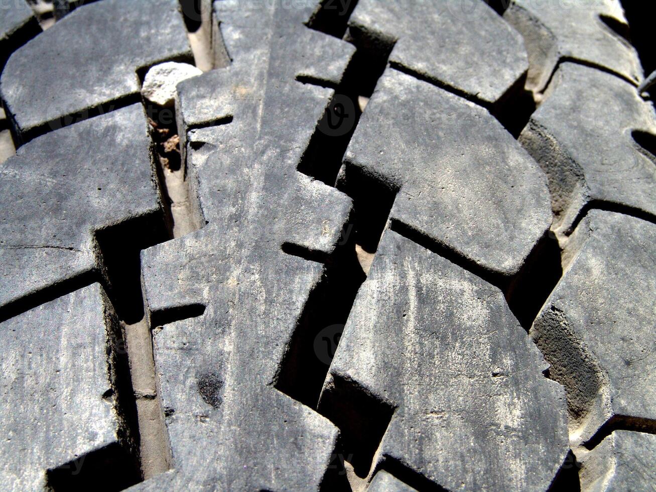 Heavy Vehicle Tire Tread with Embedded Stones photo