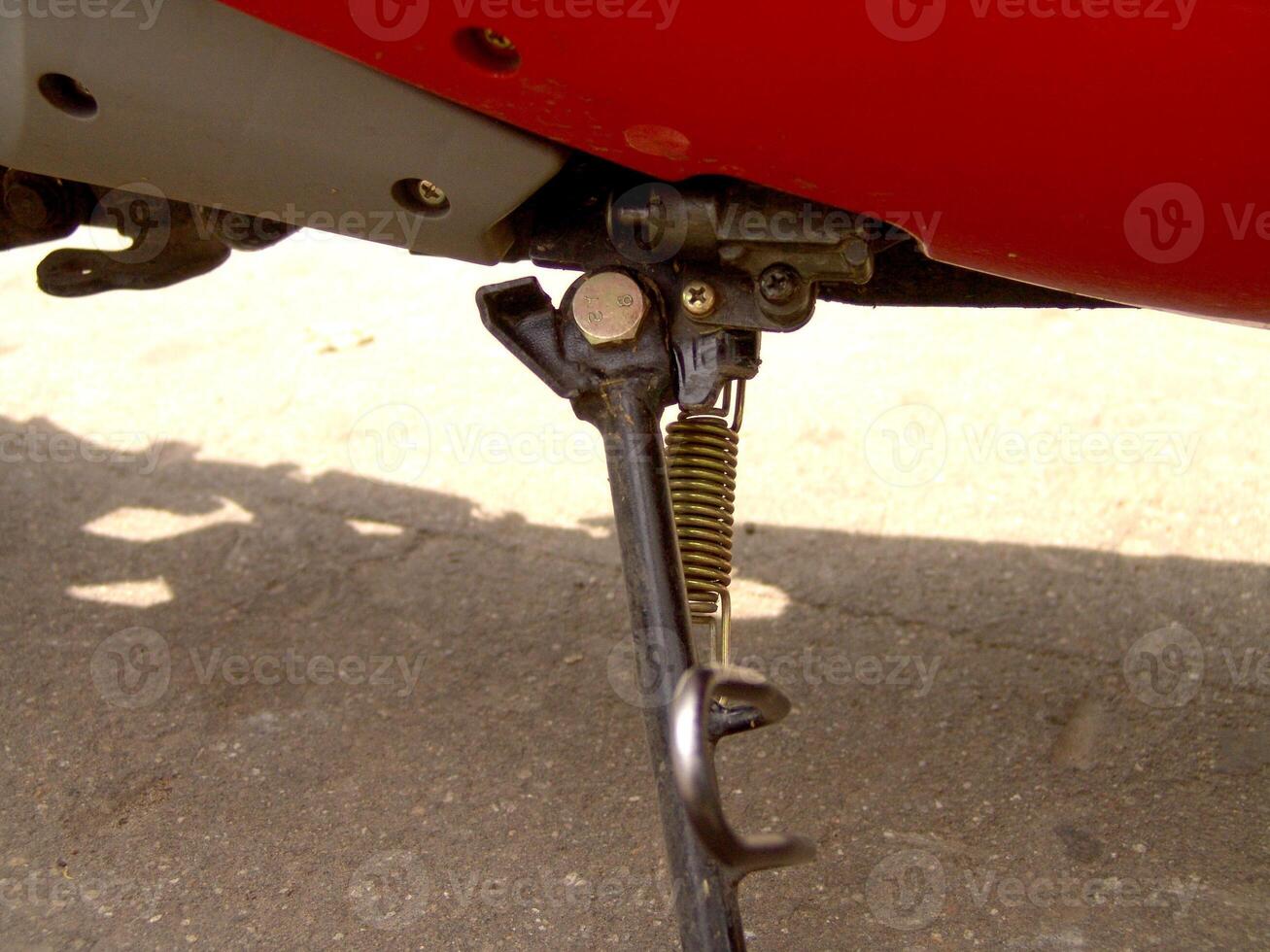 Motorcycle Kickstand and Spring Close Up photo