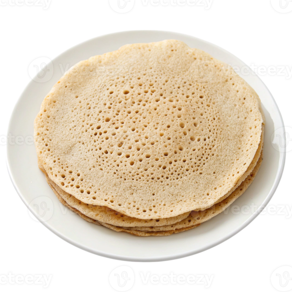 A stack of traditional Ethiopian injera bread on a white plate, showcasing its unique texture and holes. png