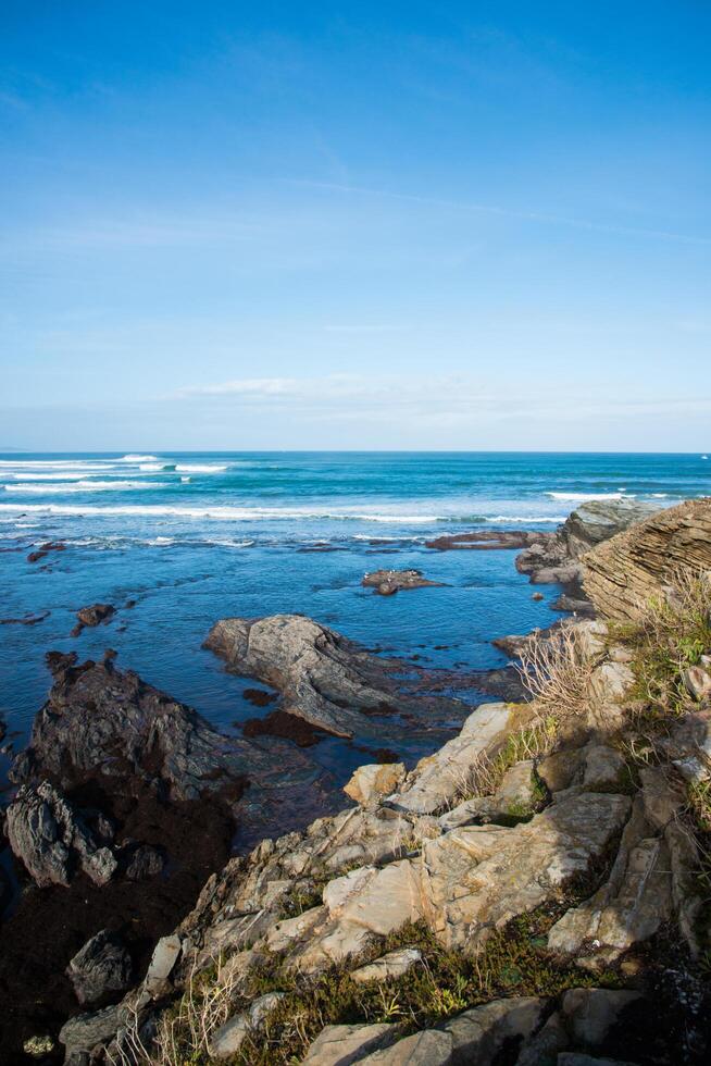 Rocky asturian coastline, sunny day. Cantabrian sea. photo