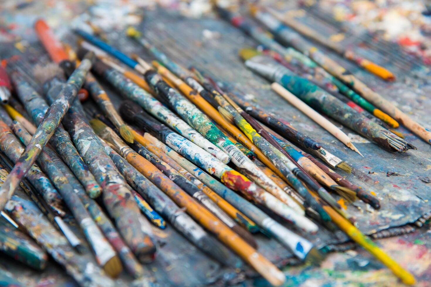 Backgrounds. Close up of artist paintbrushes on a tray photo