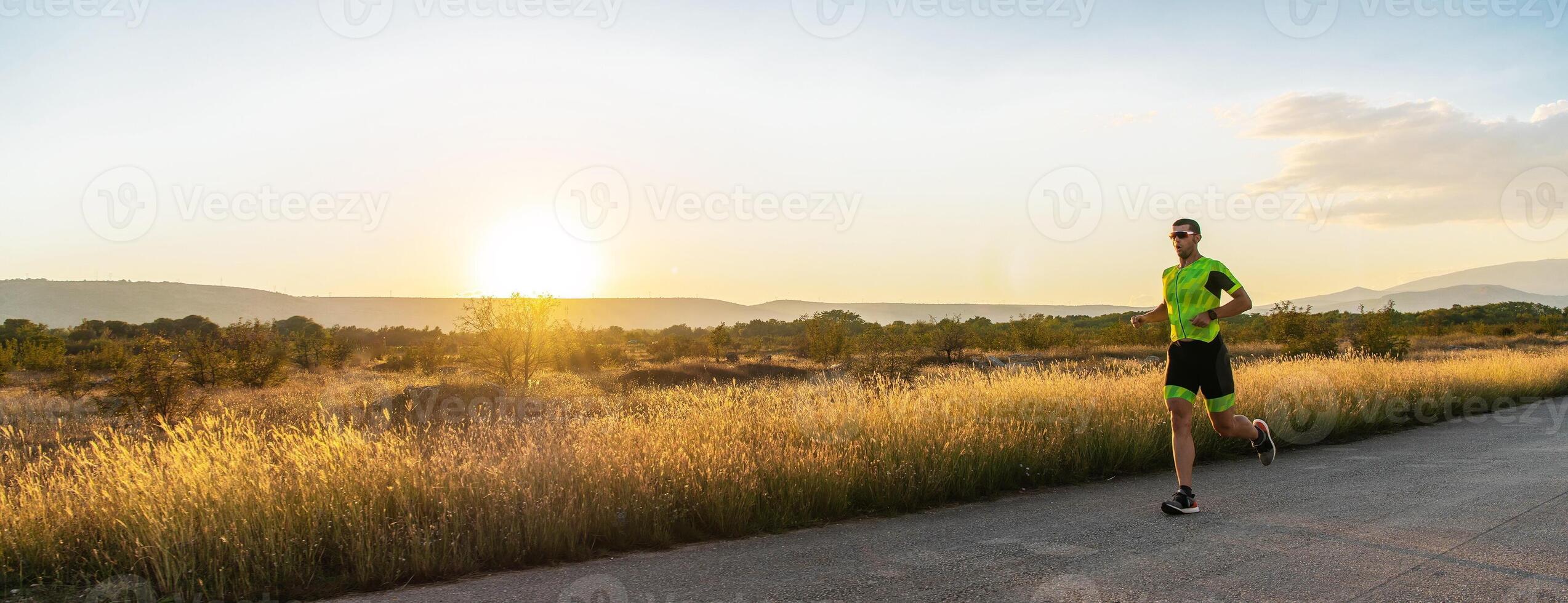 Triathlete in professional gear running early in the morning, preparing for a marathon, dedication to sport and readiness to take on the challenges of a marathon. photo