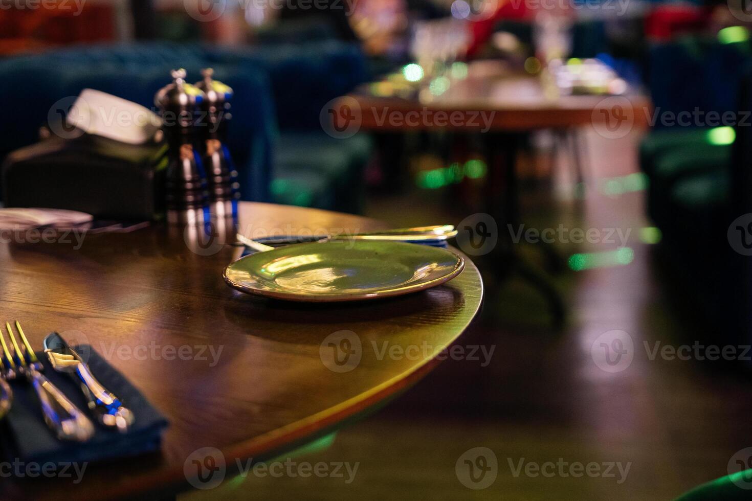 Restaurant Dining Table, Utensils. Restaurant table set for dining at night for enjoyment and relaxation. photo