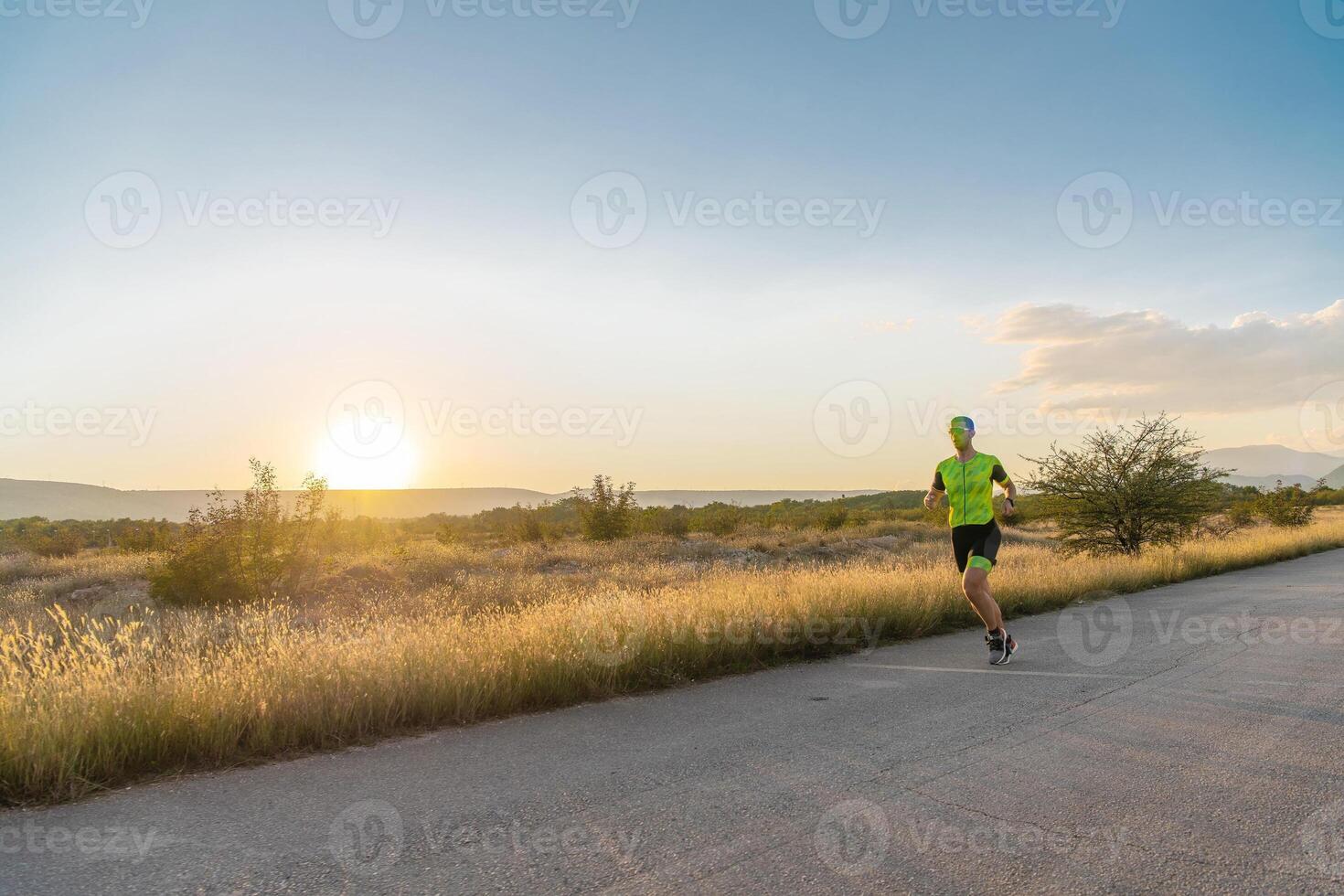 Triathlete in professional gear running early in the morning, preparing for a marathon, dedication to sport and readiness to take on the challenges of a marathon. photo