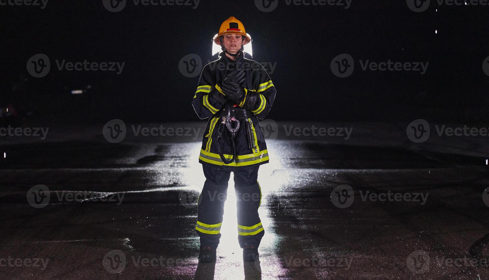 Portrait of a female firefighter standing and walking brave and optimistic photo