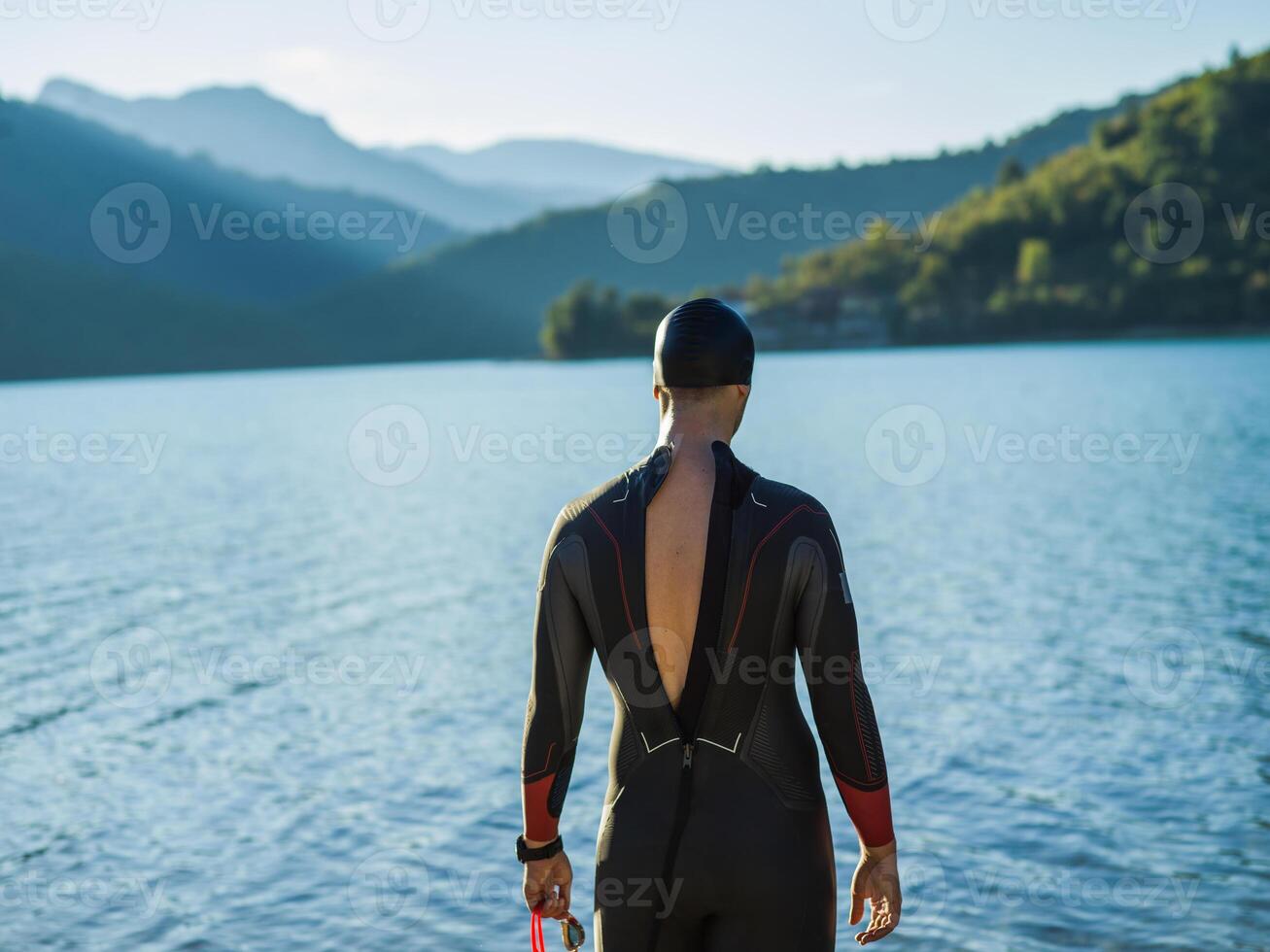 A triathlon swimmer preparing for a river training to gear up for a marathon photo