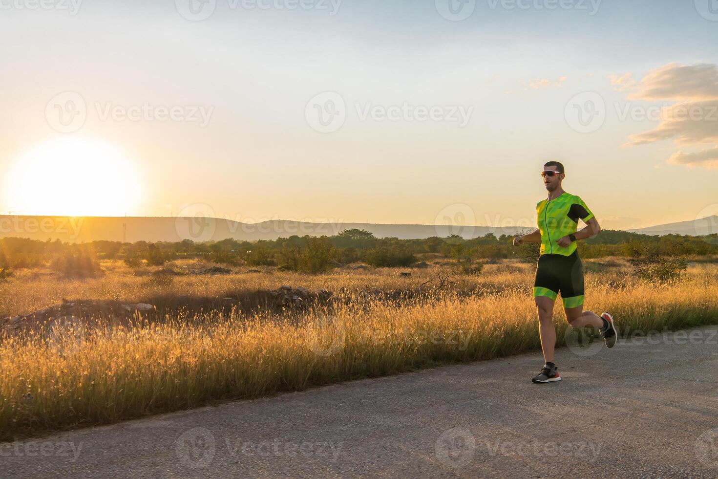 Triathlete in professional gear running early in the morning, preparing for a marathon, dedication to sport and readiness to take on the challenges of a marathon. photo