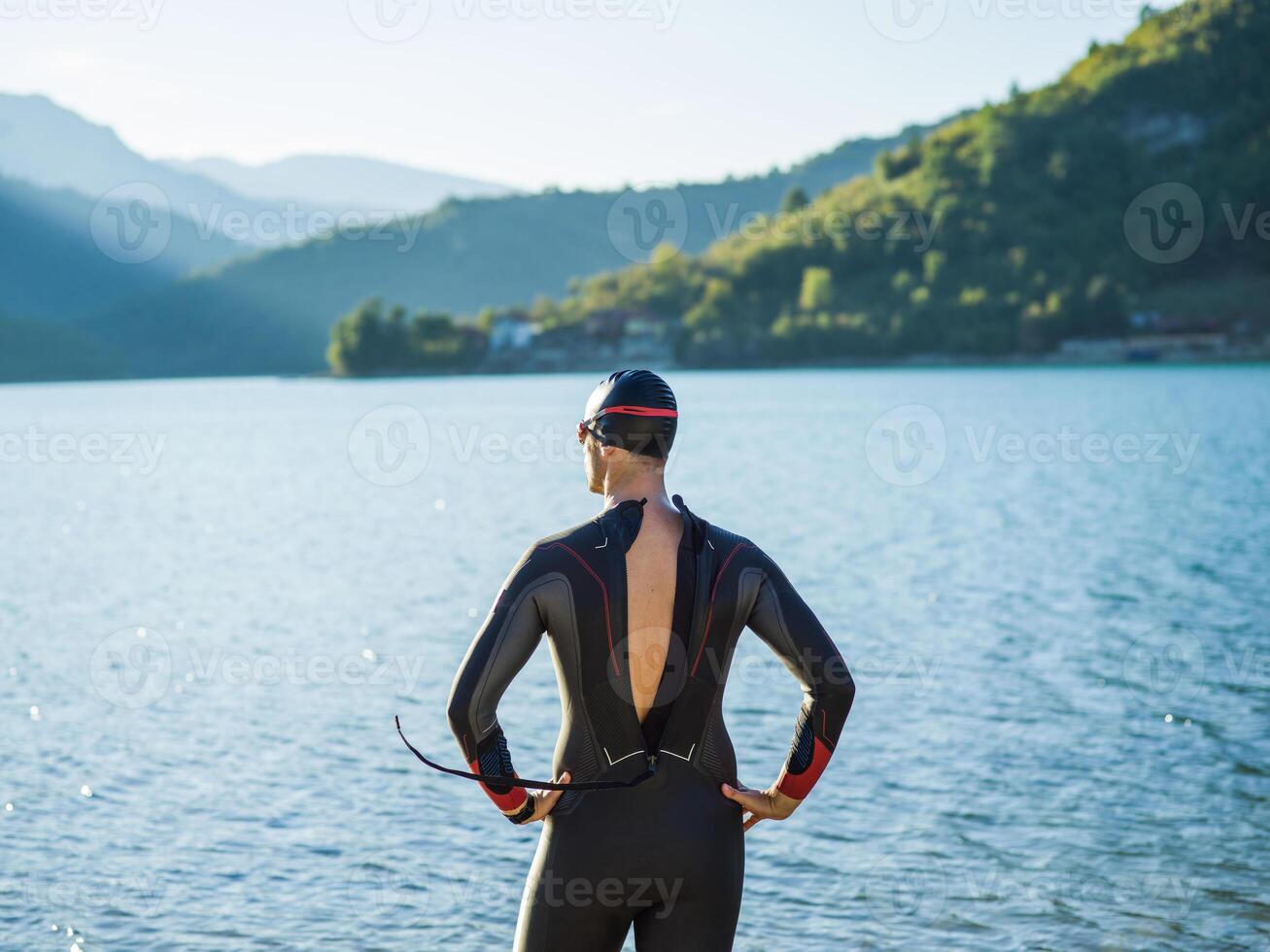 A triathlon swimmer preparing for a river training to gear up for a marathon photo