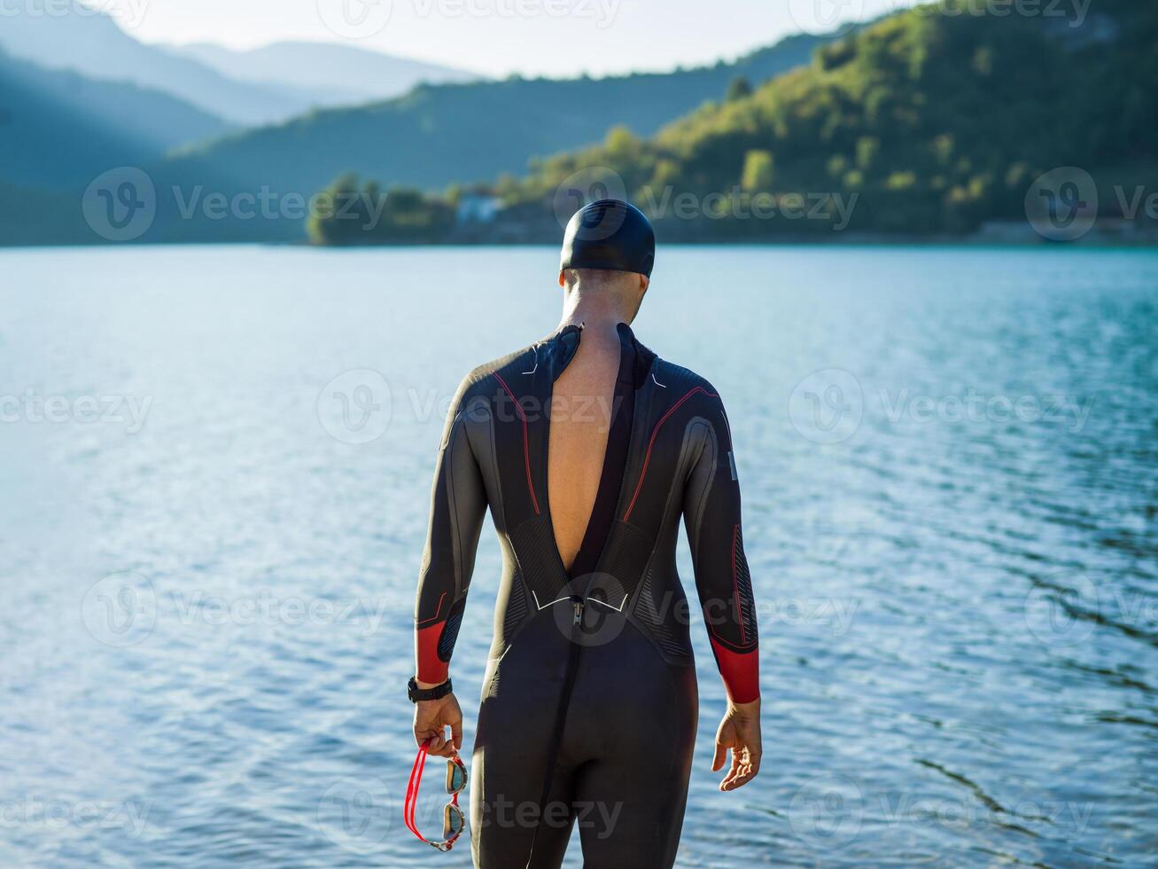 A triathlon swimmer preparing for a river training to gear up for a marathon photo