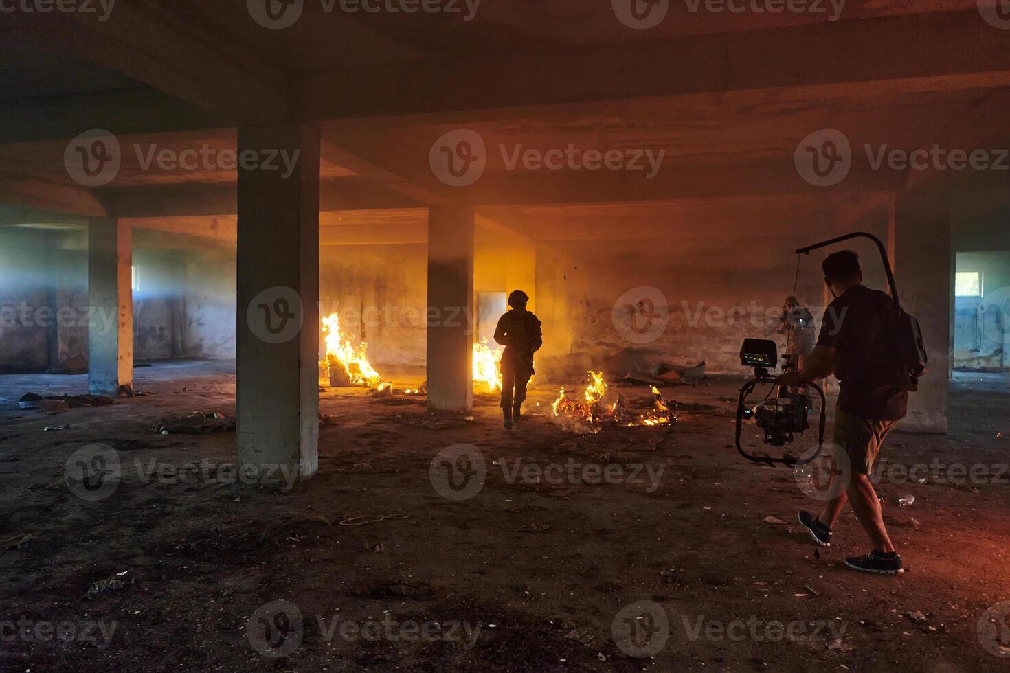A professional cameraman captures the intense moments as a group of skilled soldiers embarks on a dangerous mission inside an abandoned building, their actions filled with suspense and bravery photo