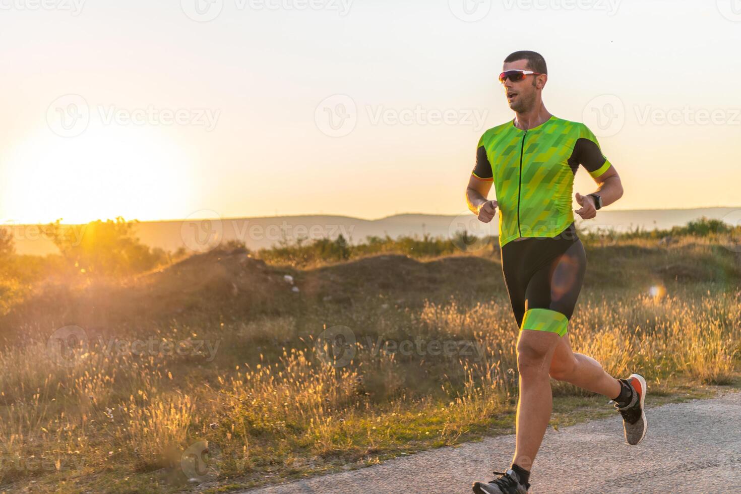 Triathlete in professional gear running early in the morning, preparing for a marathon, dedication to sport and readiness to take on the challenges of a marathon. photo