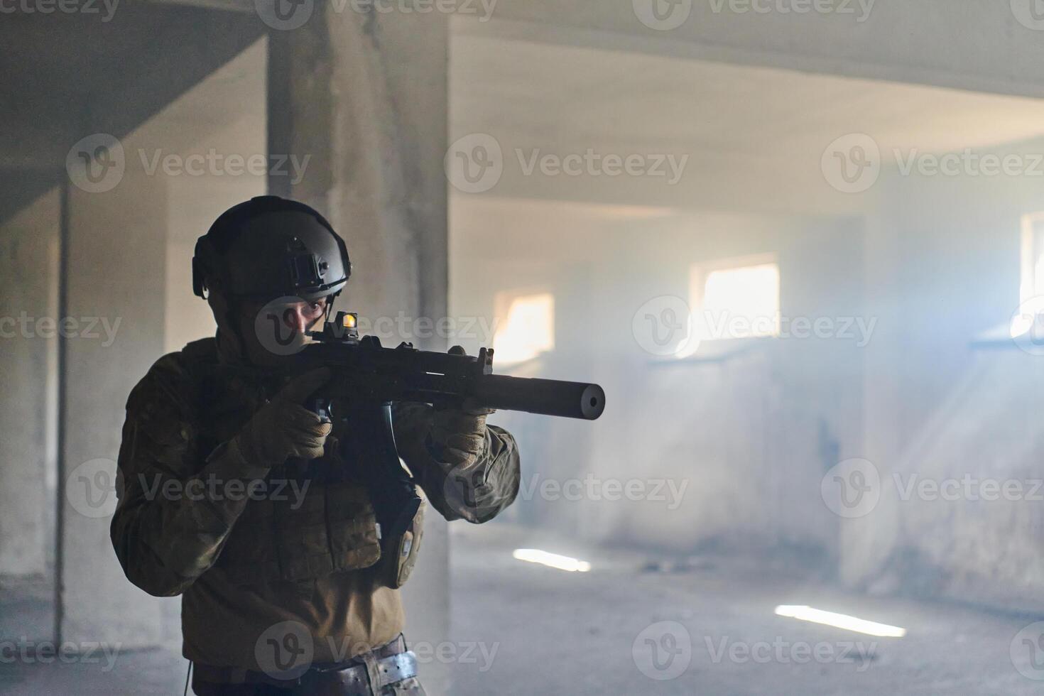 A professional soldier in an abandoned building shows courage and determination in a war campaign photo