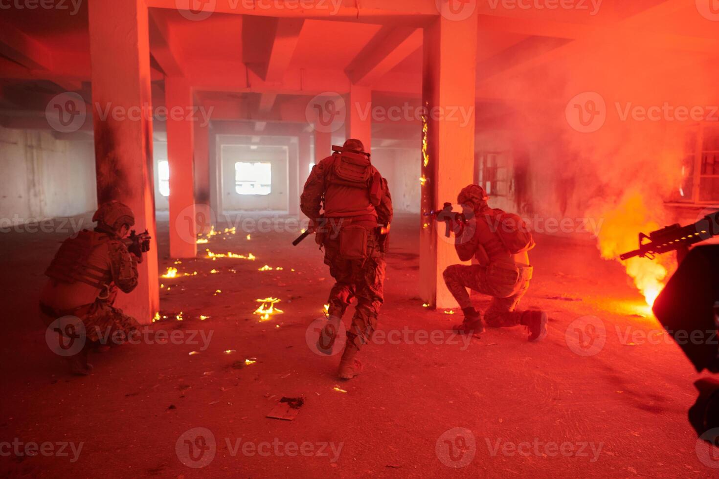A group of professional soldiers bravely executes a dangerous rescue mission, surrounded by fire in a perilous building. photo